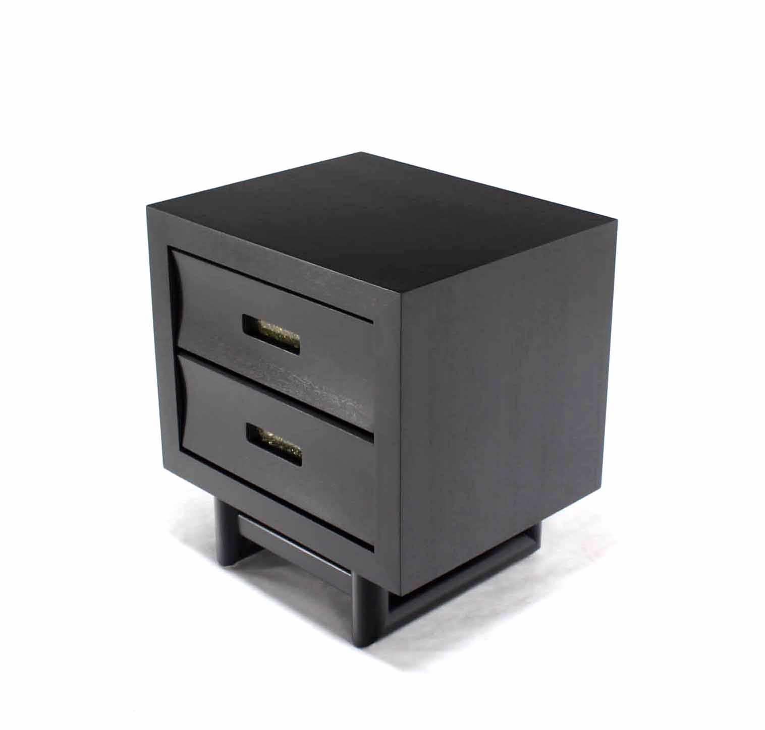 Pair or Mid-Century Modern black lacquer nightstands or end tables.