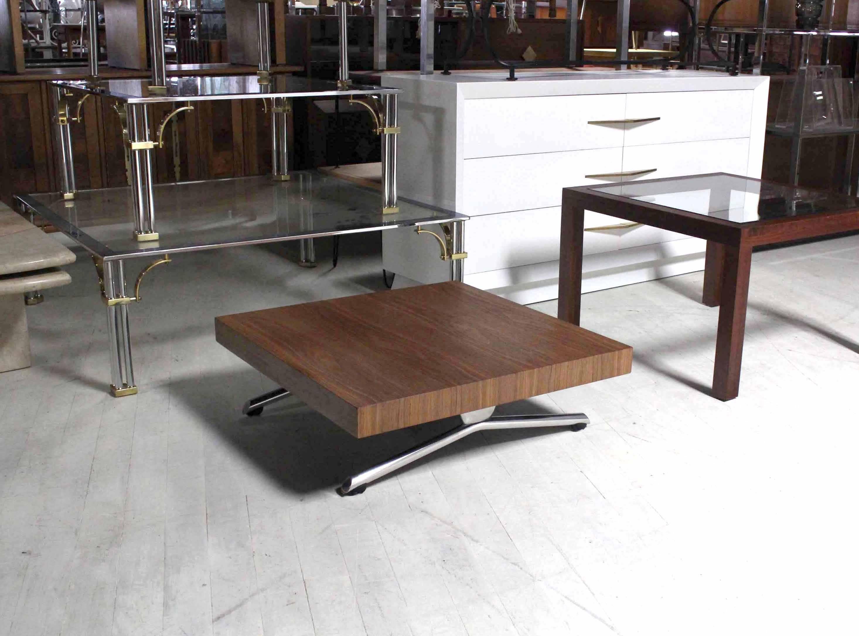 Unusual splay leg Mid Century Modern style walnut top square coffee table. Measures: 32 x 32".