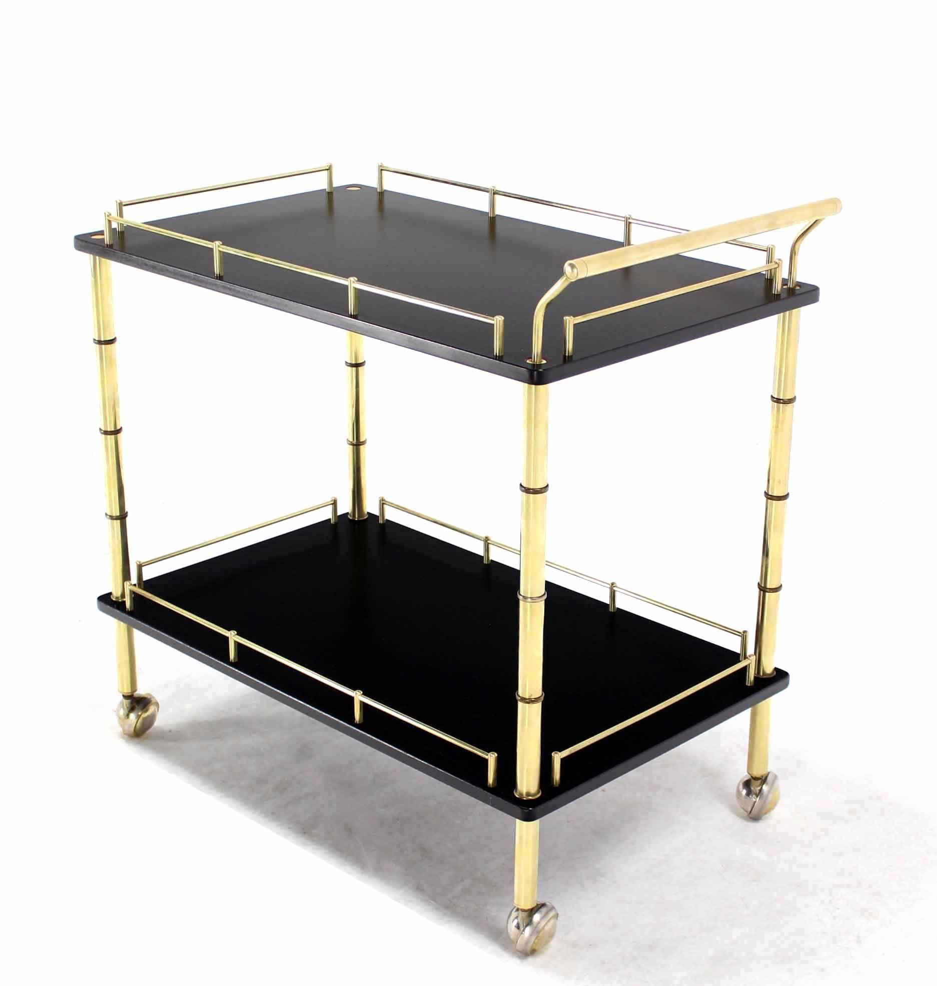 Mid-Century Modern faux bamboo brass rolling bar cart. Beautiful craftsmanship and design detail piece.







In style of Maison Bagues
