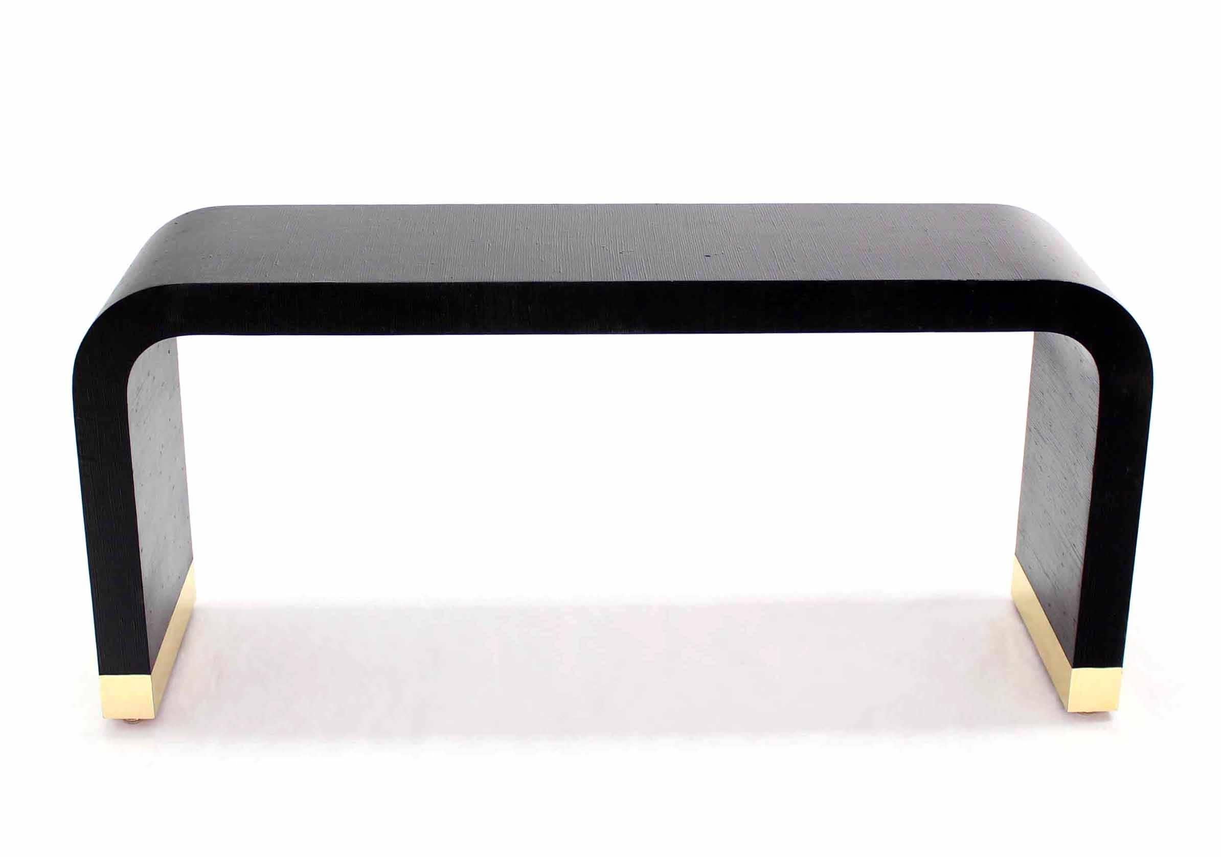Black lacquer grass cloth sofa table with brass base.