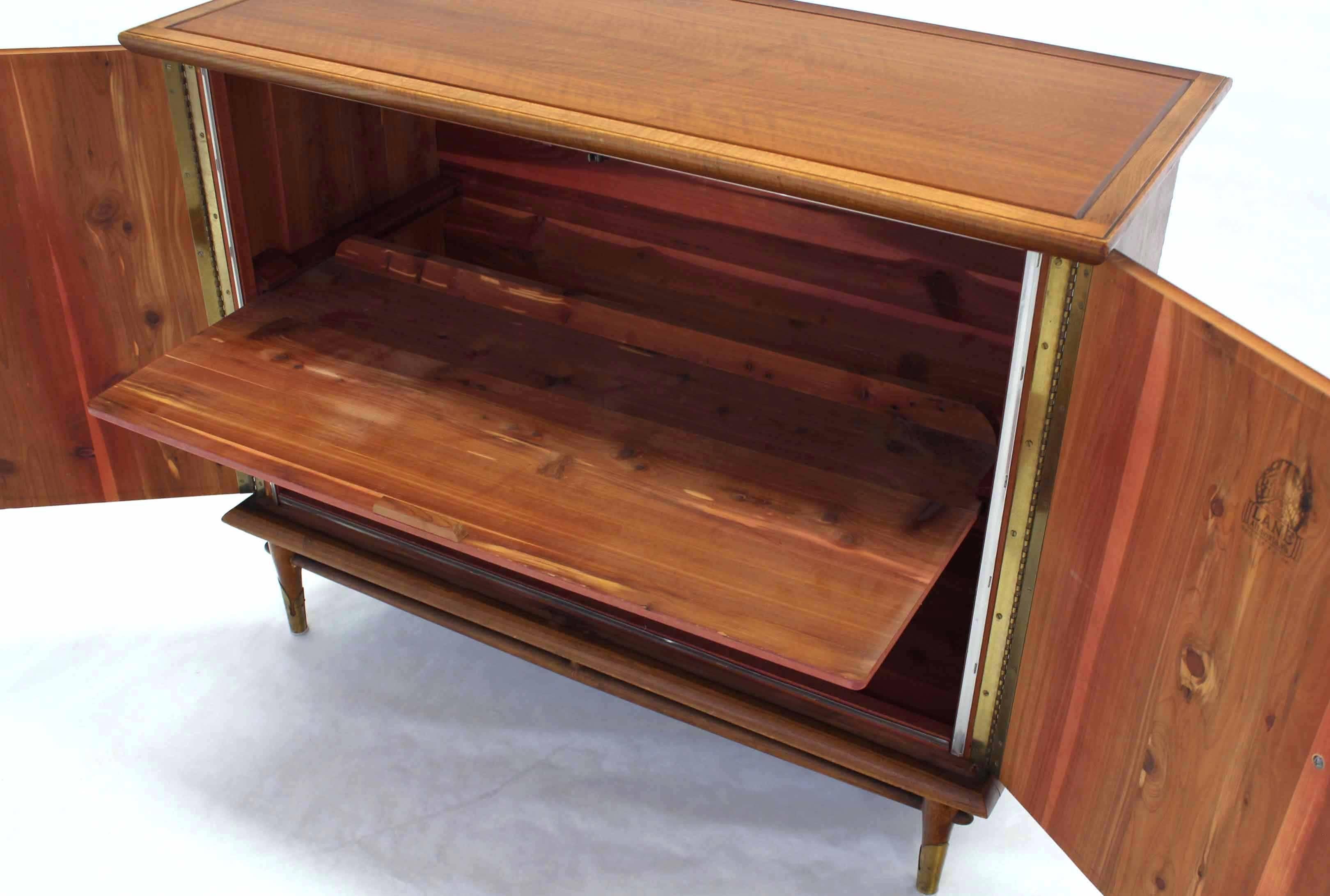 Hope chest alternative. Made to function like two doors dresser or bachelor cabinet. Two door with ring pulls one removable shelf finished in cedar.
