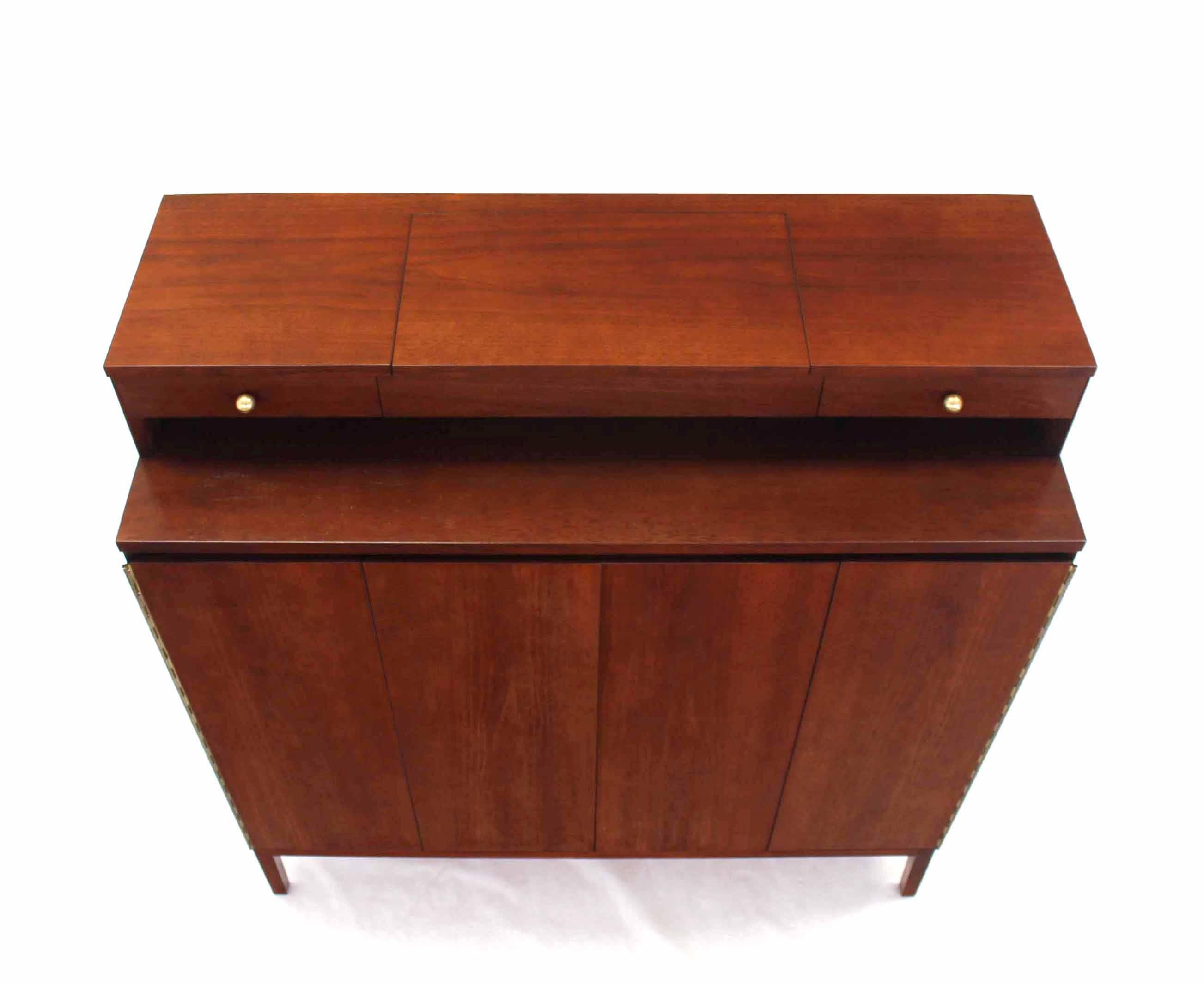 Paul McCobb high chest of drawers with lift top mirror vanity.