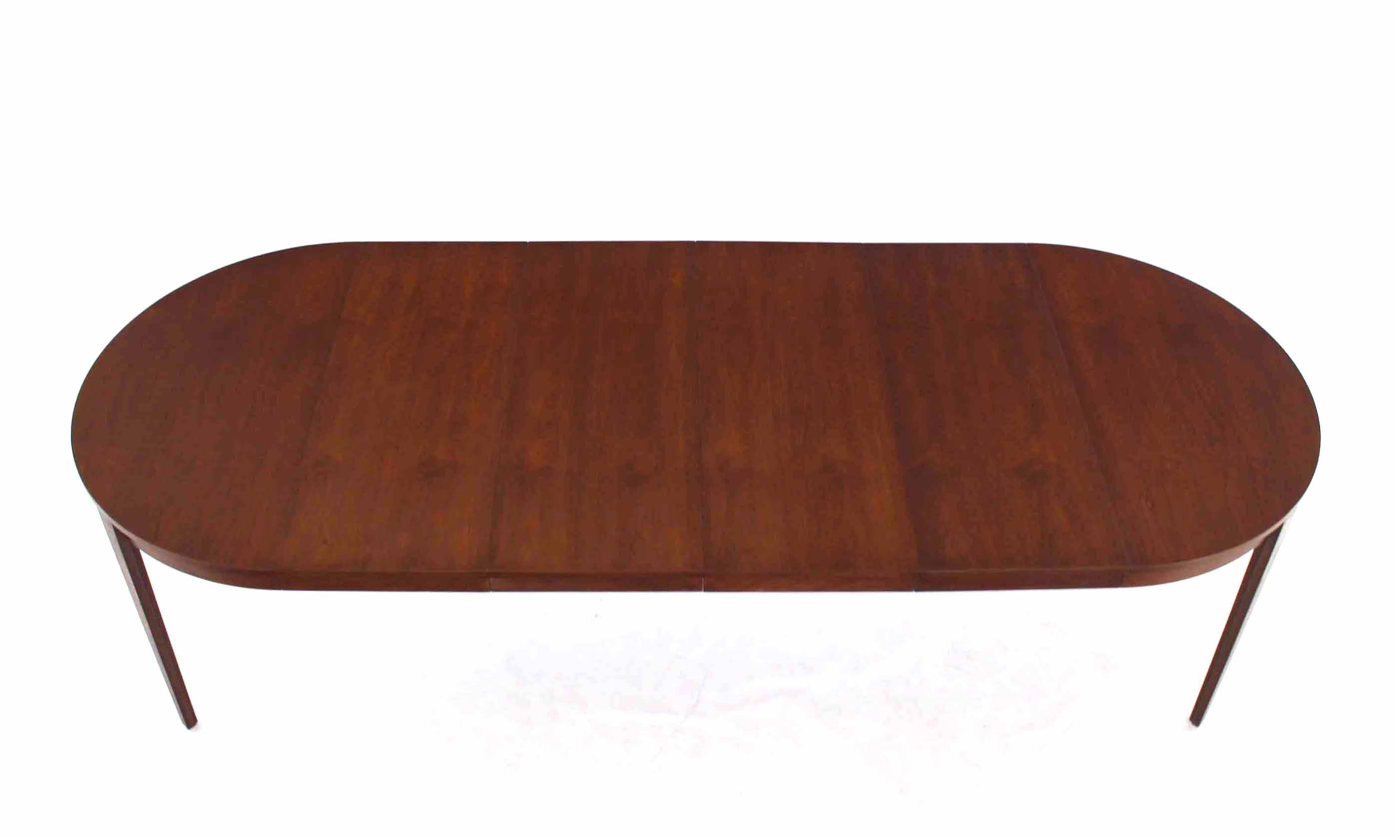Mid-Century Modern walnut Dunbar table with 4x16 - leaves.