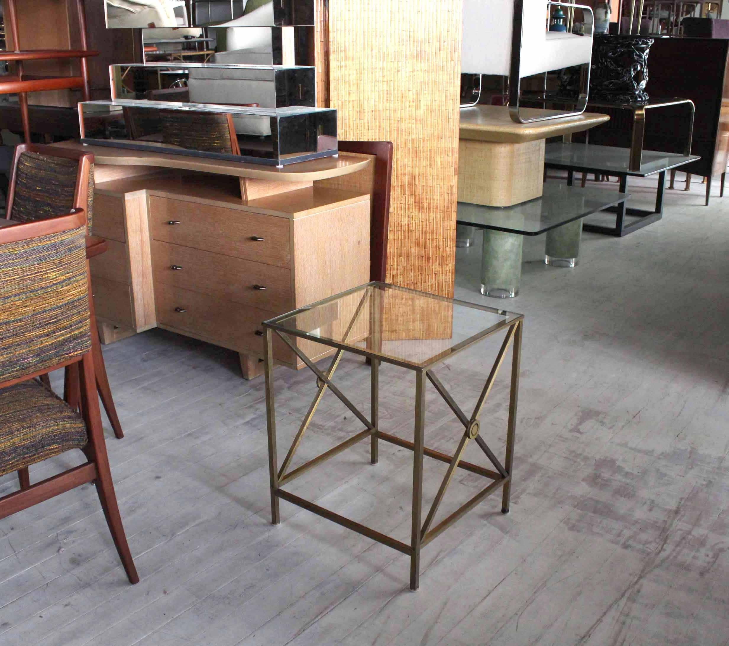 Mid century modern forged  brass X base side table stand with glass top.