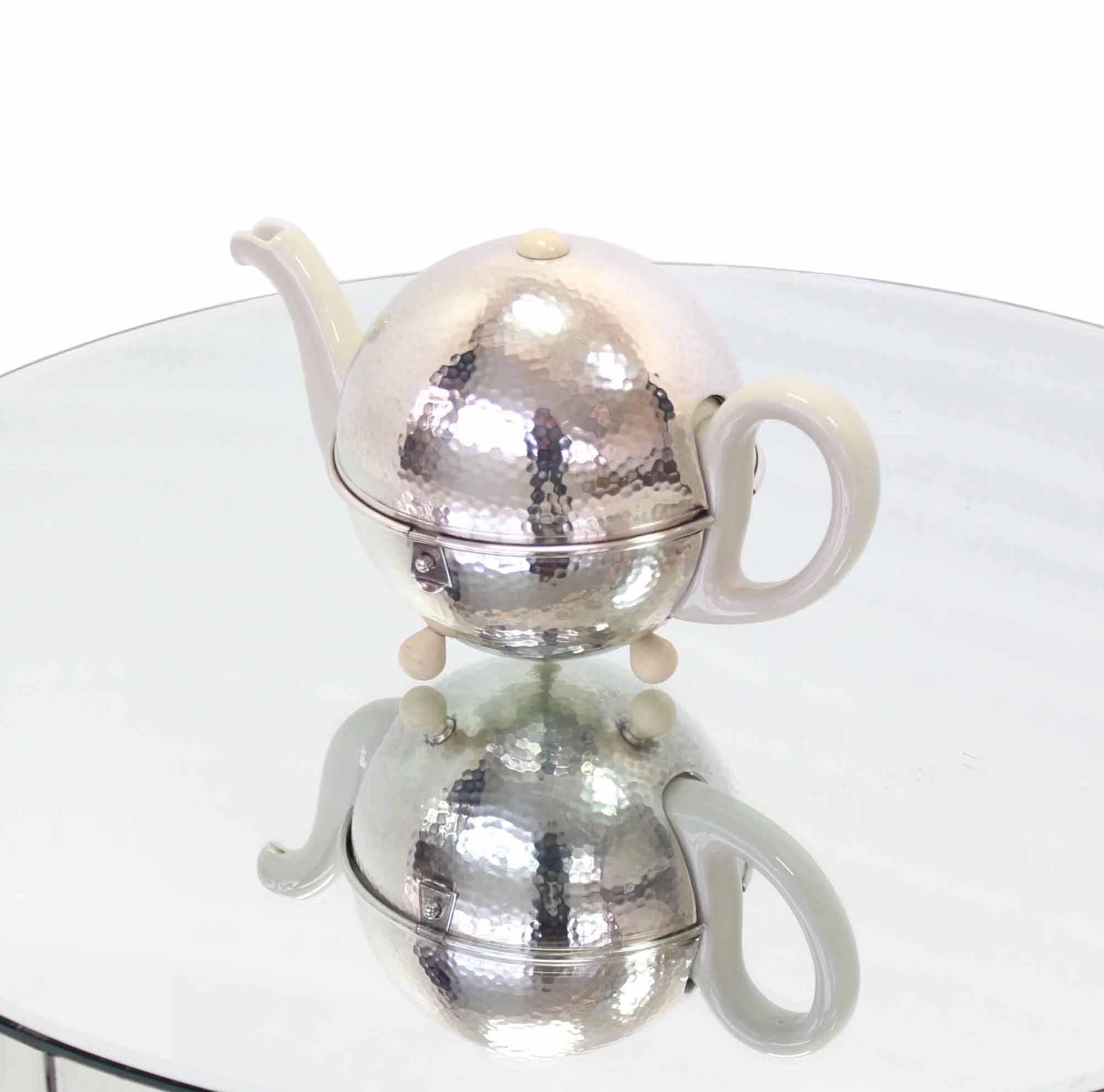 vintage teapot with metal cover