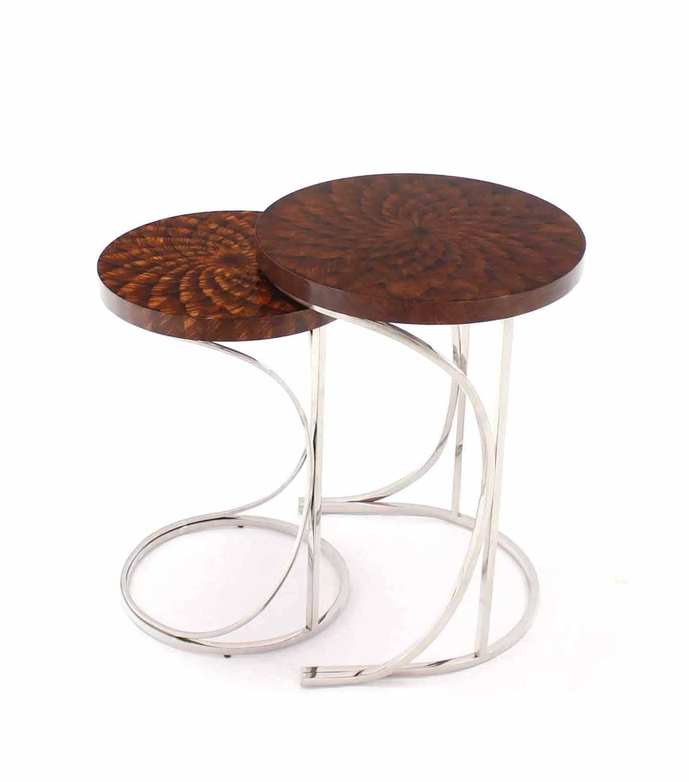 Outstanding quality stainless steel bases beautiful wood marquetry top nesting tables.
