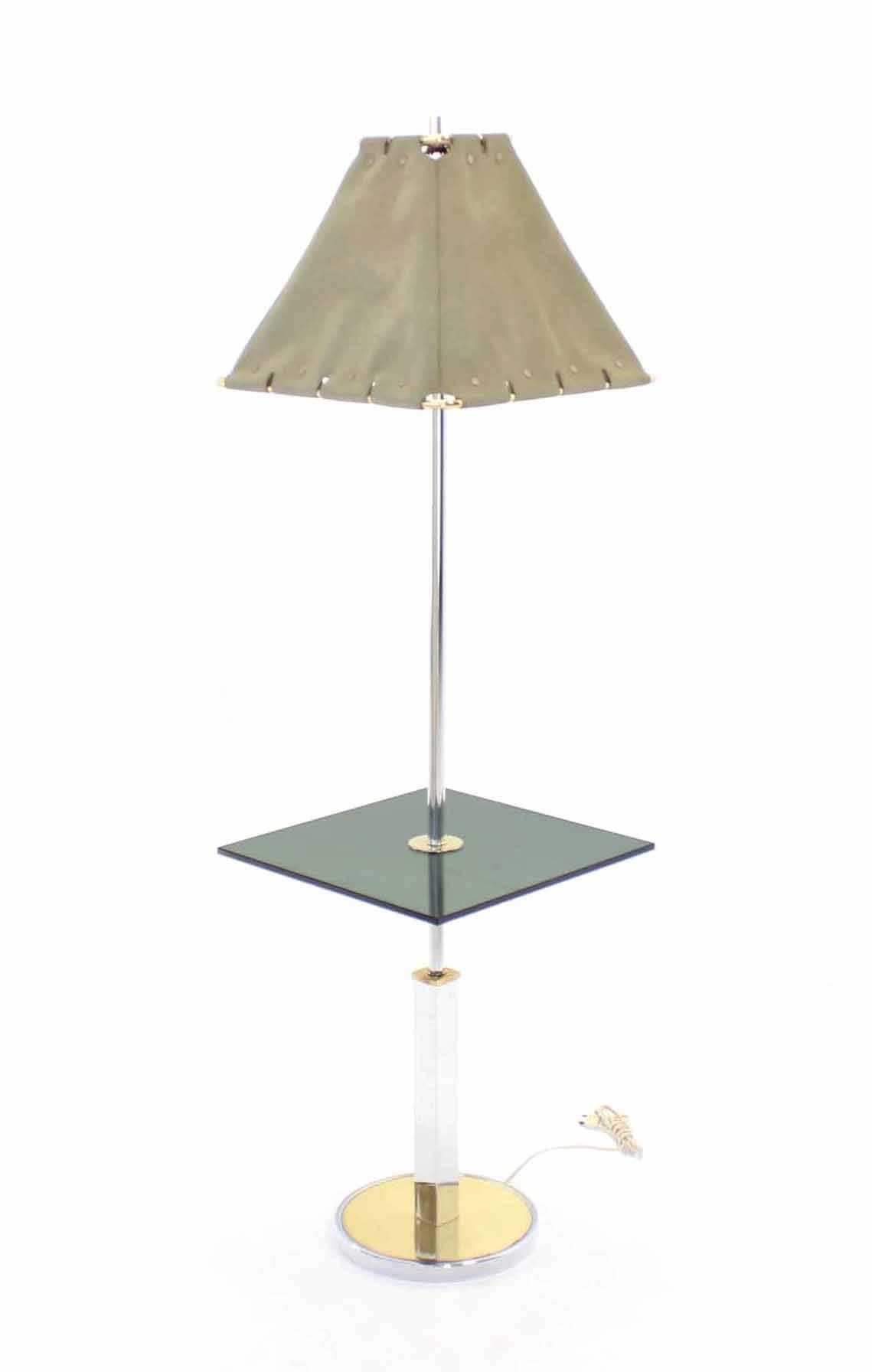 Very nice mid-century modern floor lamp side table with original faux leather shade.
