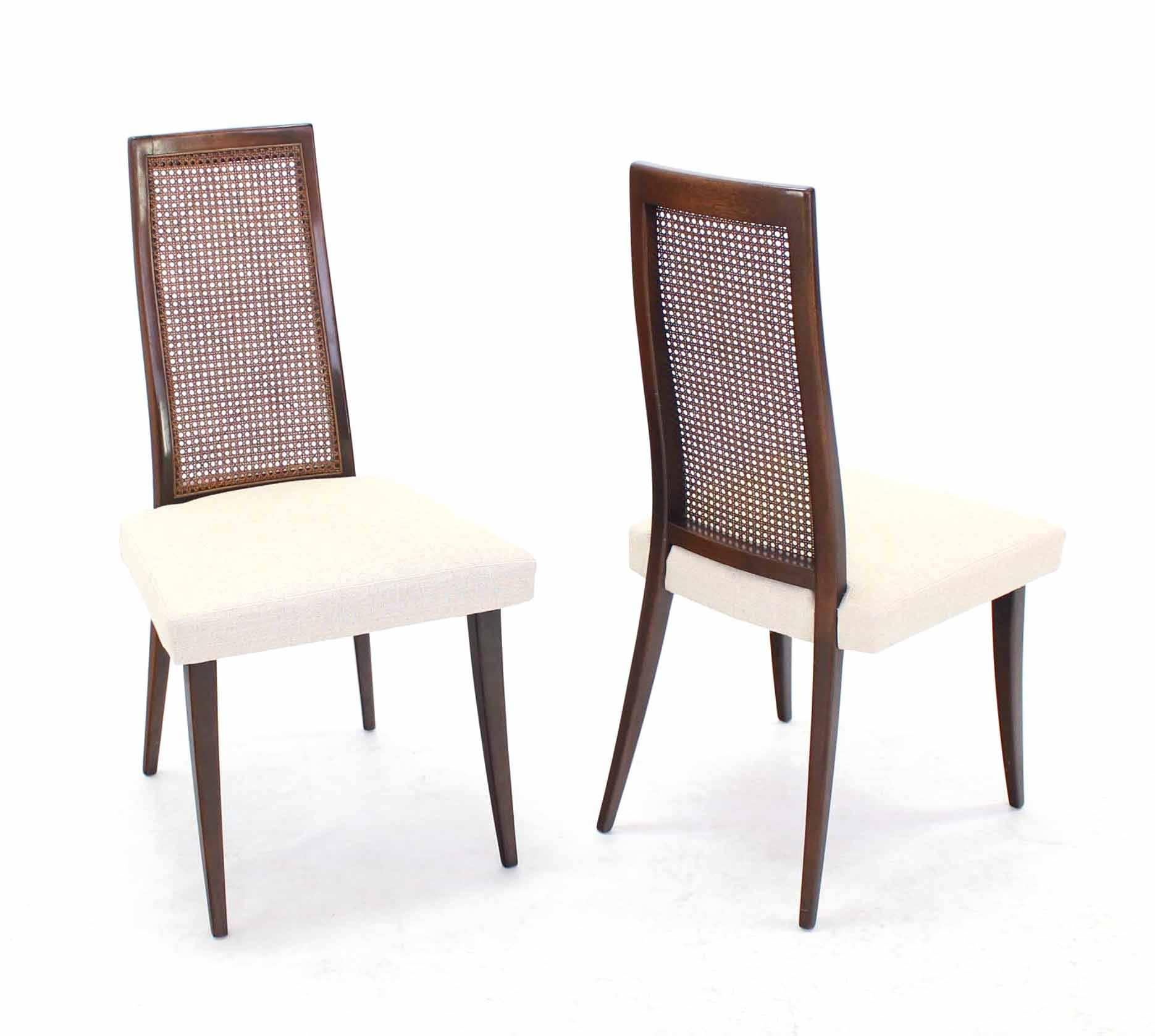 Set of six newly upholstered Harvey Probber tapered saber leg dining chairs.