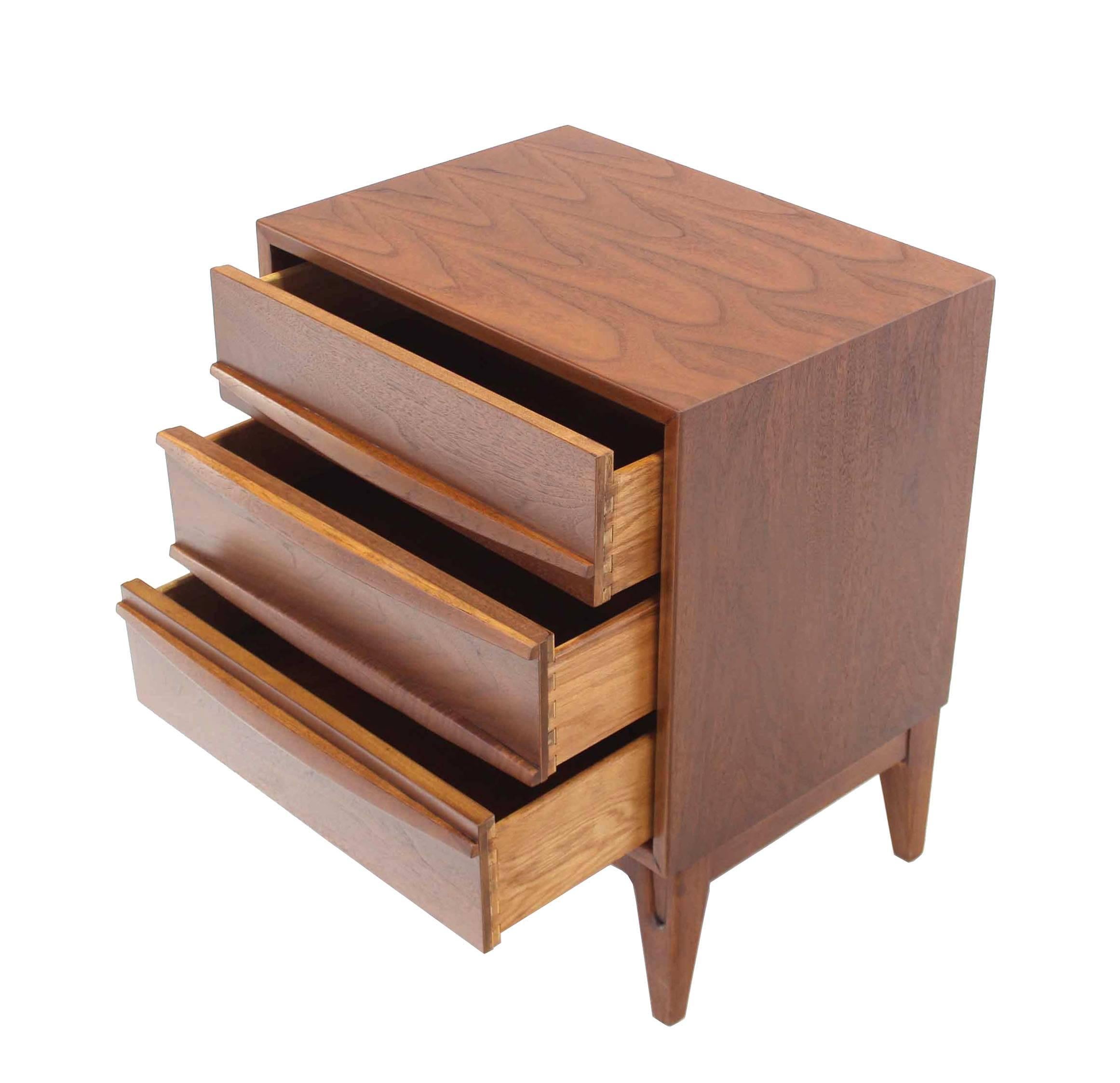 Pair of very nice mid century modern walnut 3 drawer nightstands with sculptured pulls and legs.