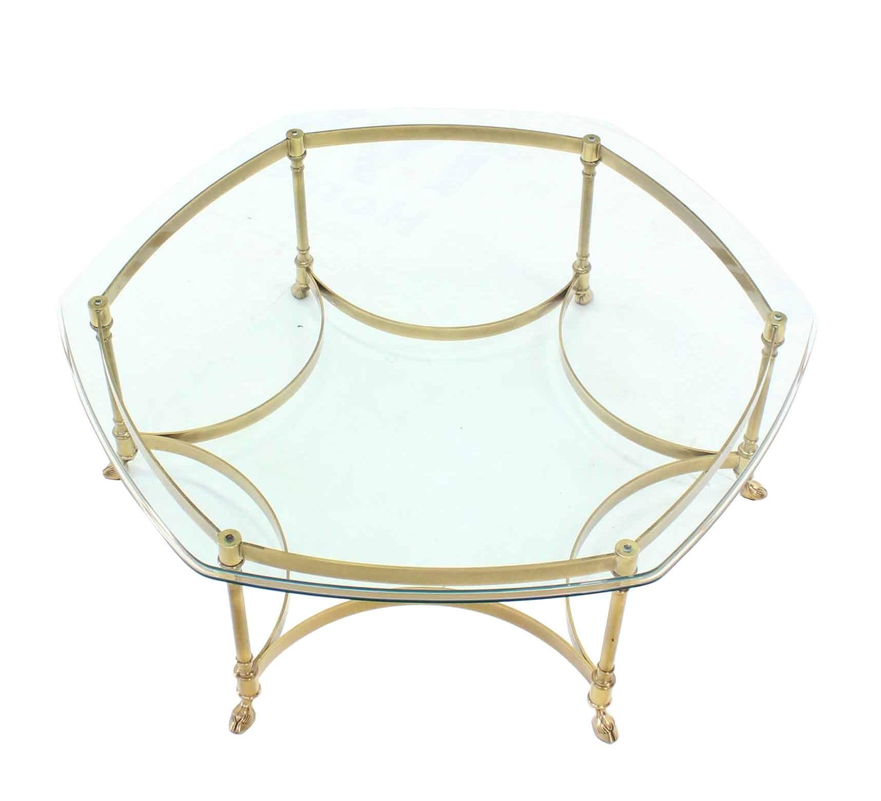 Very nice mid-century modern solid brass hoof feet glass top rounded hexagon coffee table.