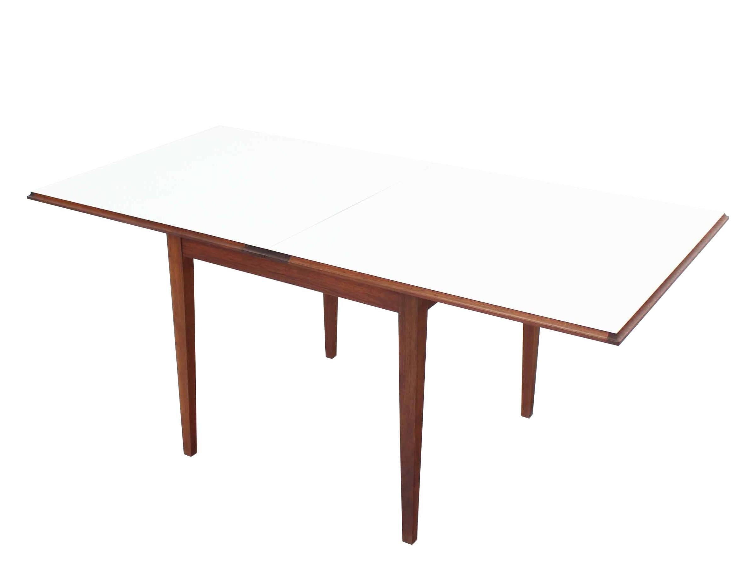 Square Mid-Century Modern flip-top expandable convertible double side game dining table. The table converts into a nice size 64x32 white laminte dining table.