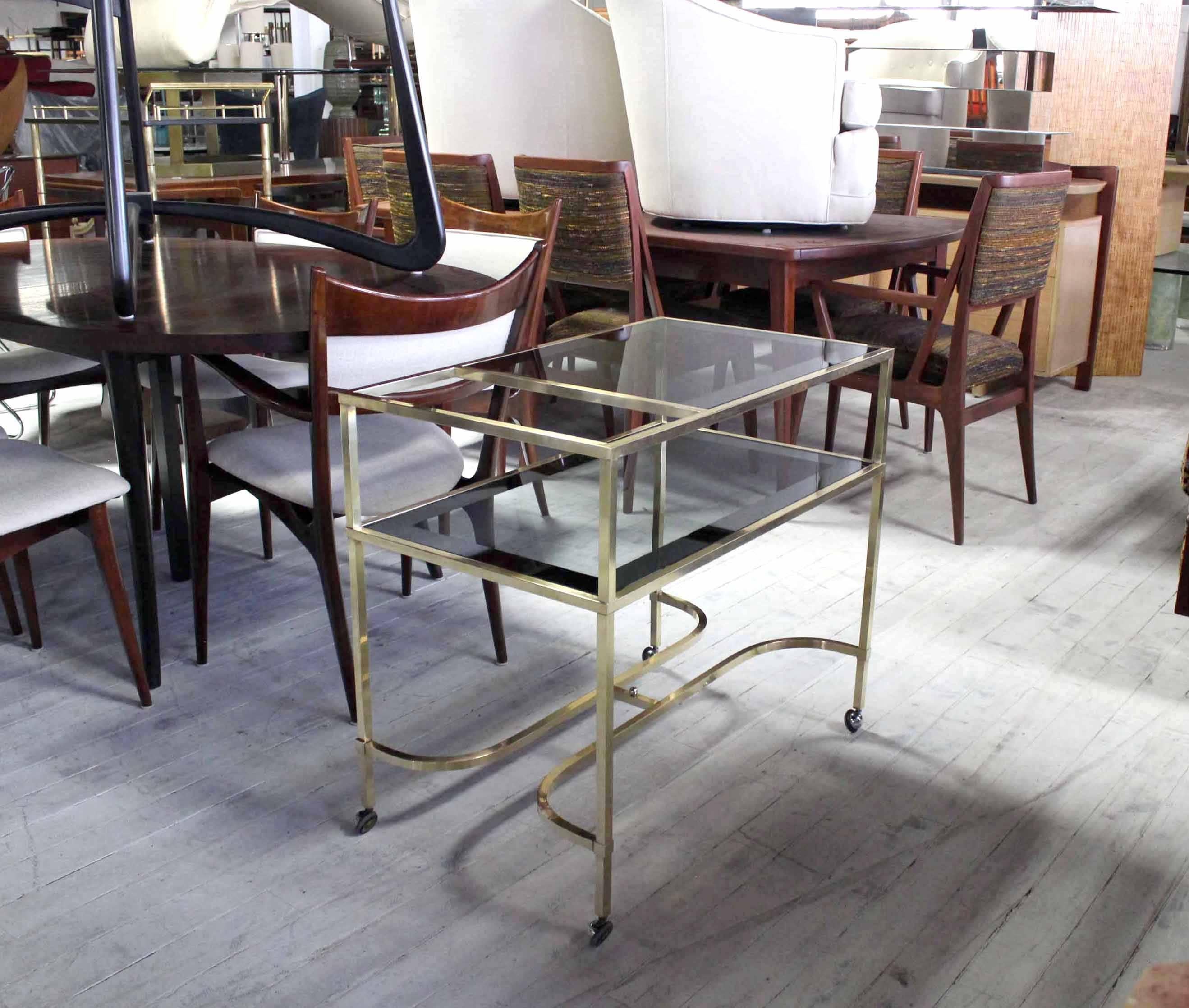 Mid Century Modern serving cart with smoked glass on Wheels.