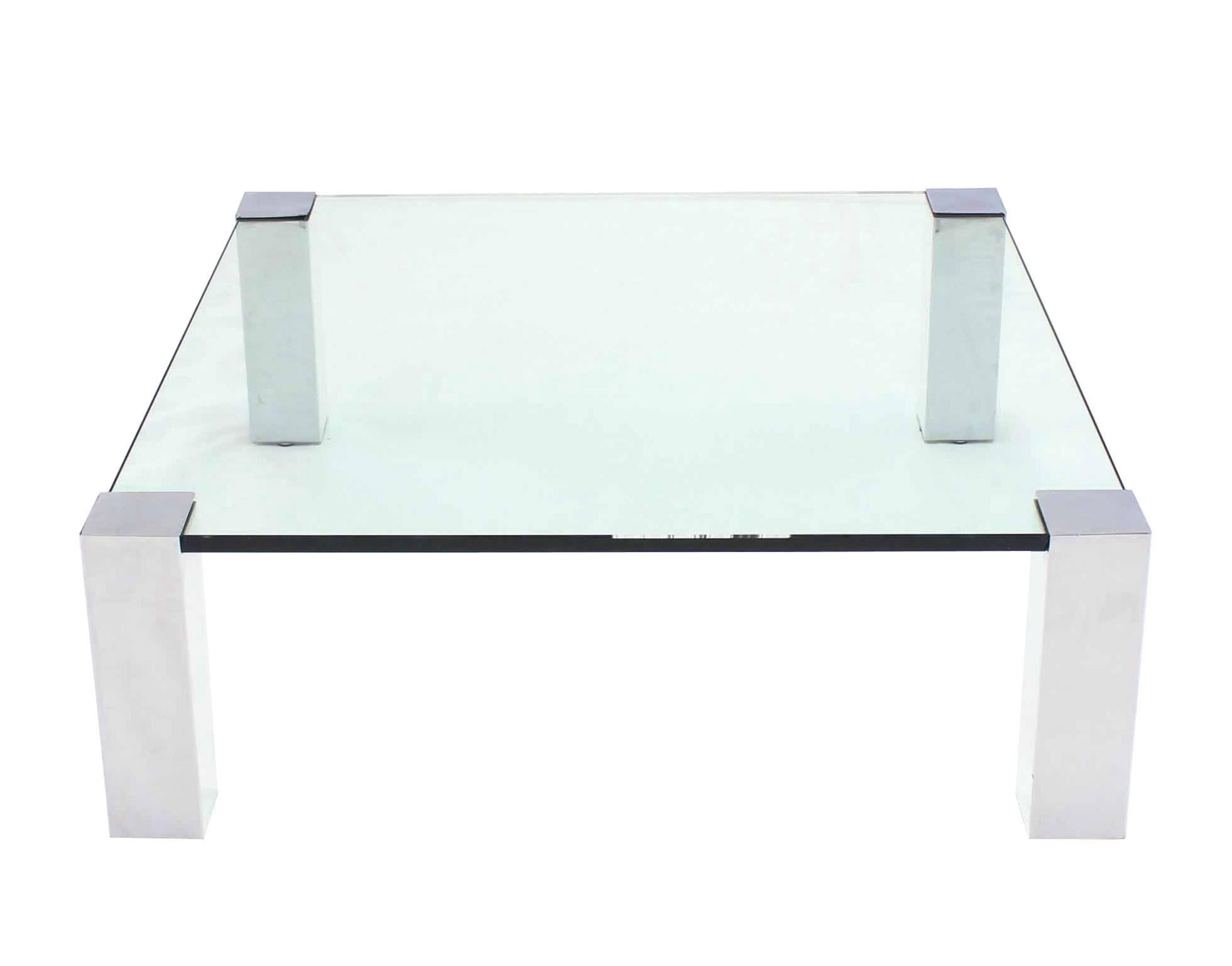 Very nice square coffee table with thick glass top and chrome legs. Measures: 41 x 41.