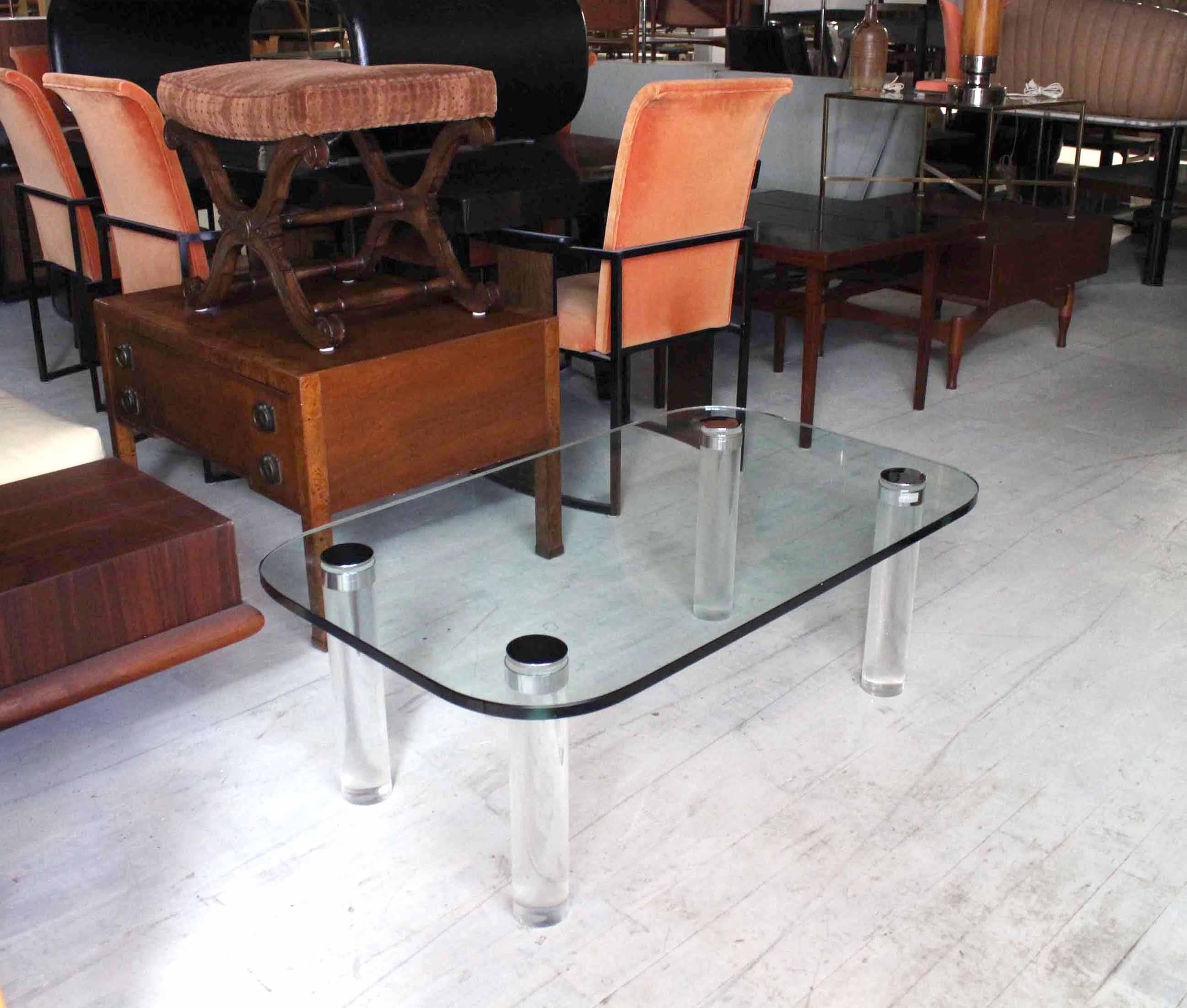 Nice thick Lucite legs coffee table with thick 3/4" glasstop. Rounded corners glass rectangle top.