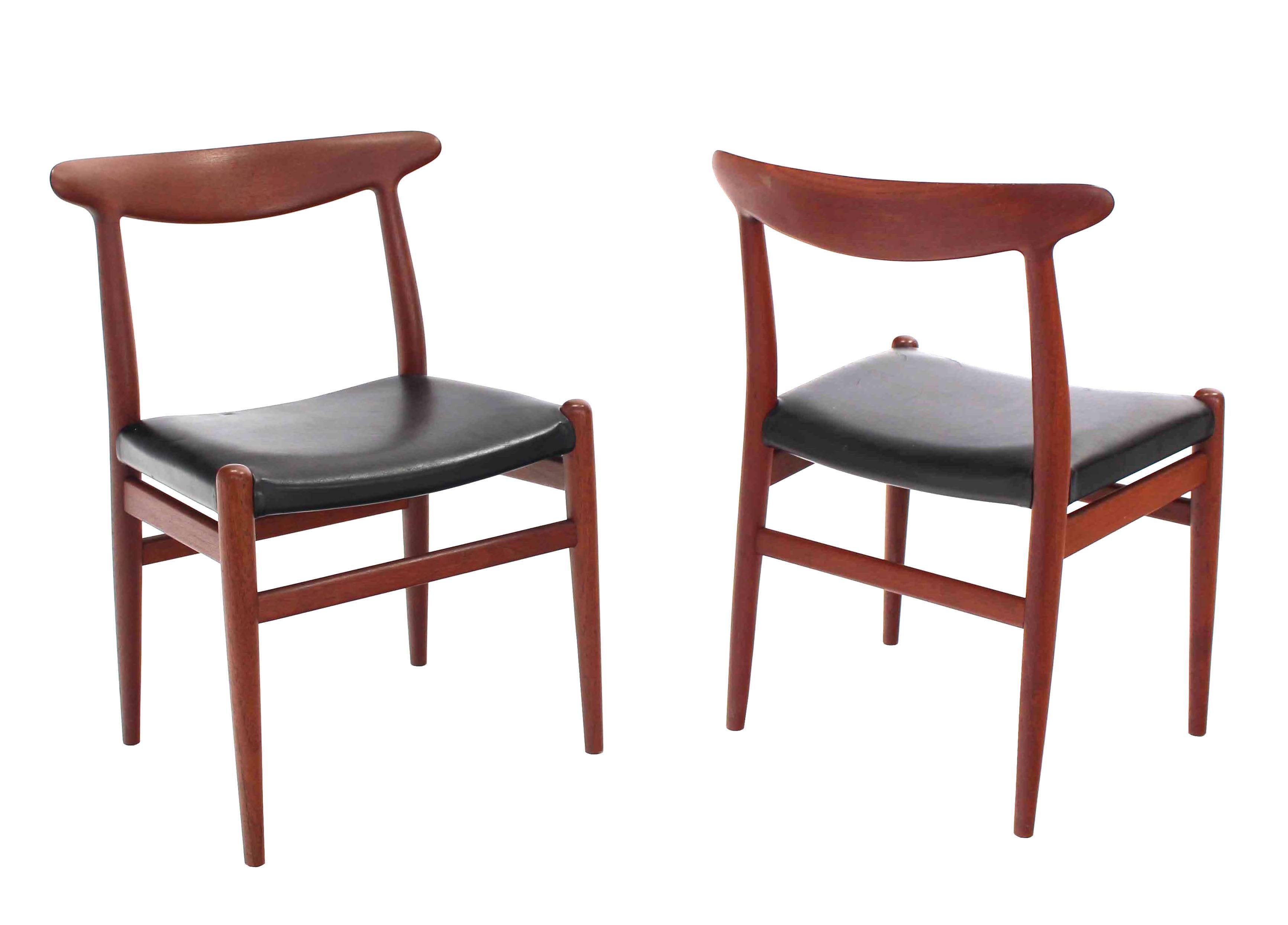 Set of four teak dining chairs by Hans Wegner.