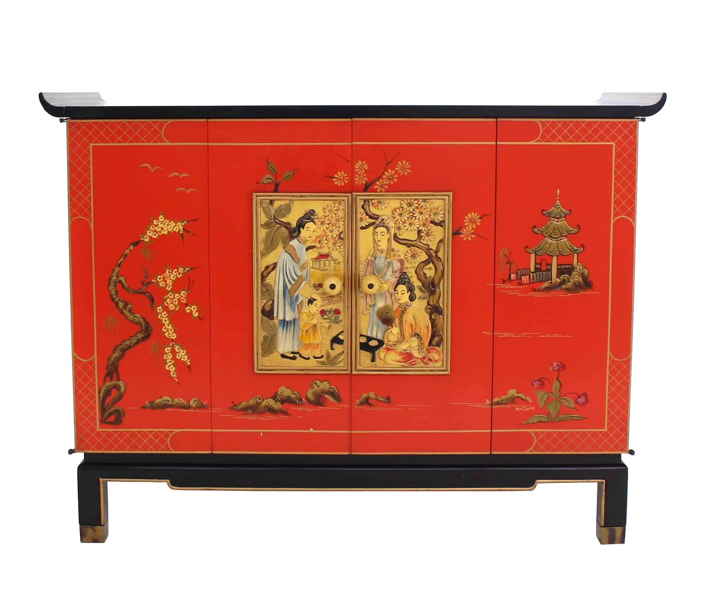 Very nice black lacquer cabinet with two oriental motive decorated accordion style doors.