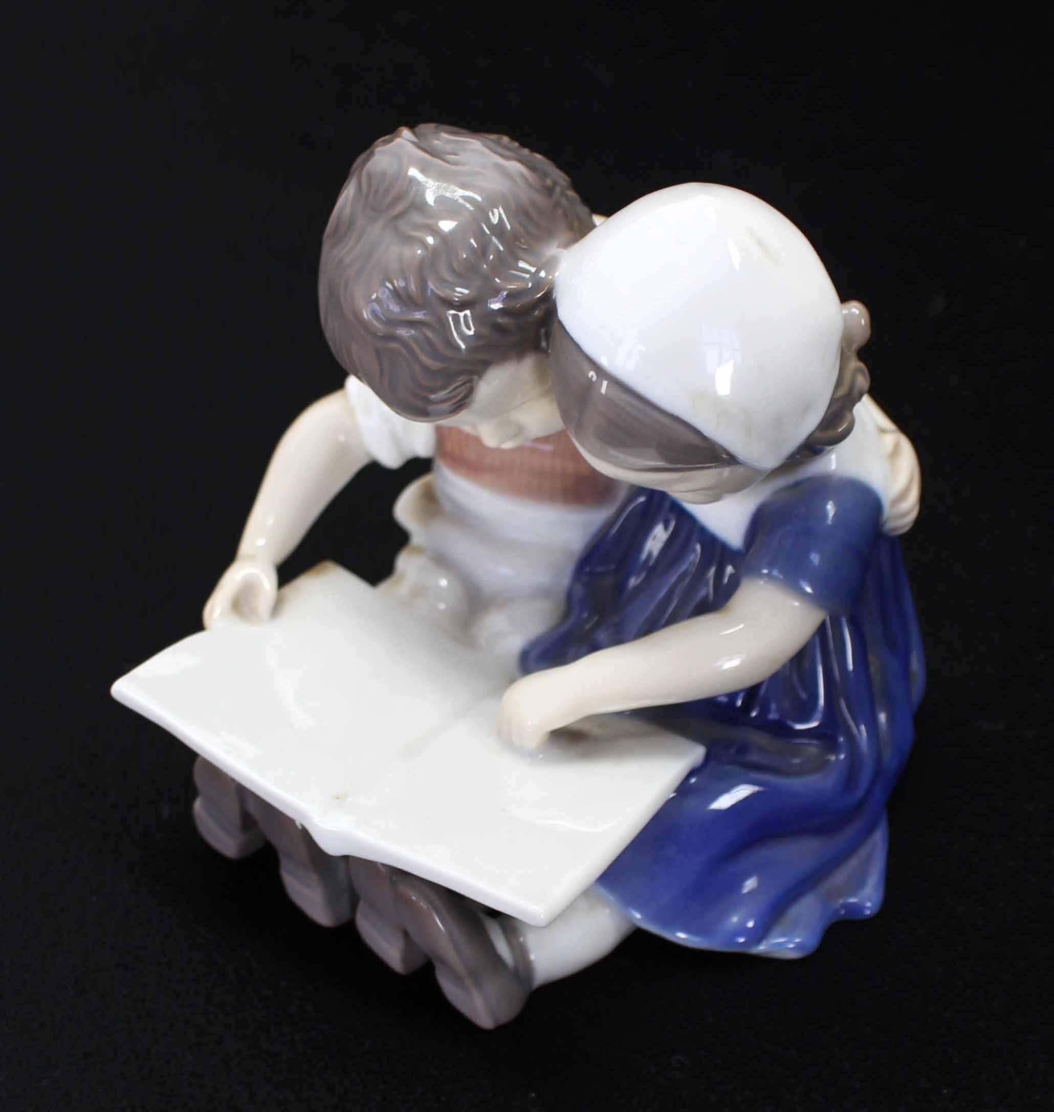 Boy & Girl Reading a Book Royal Copenhagen Figurines Group In Excellent Condition In Rockaway, NJ