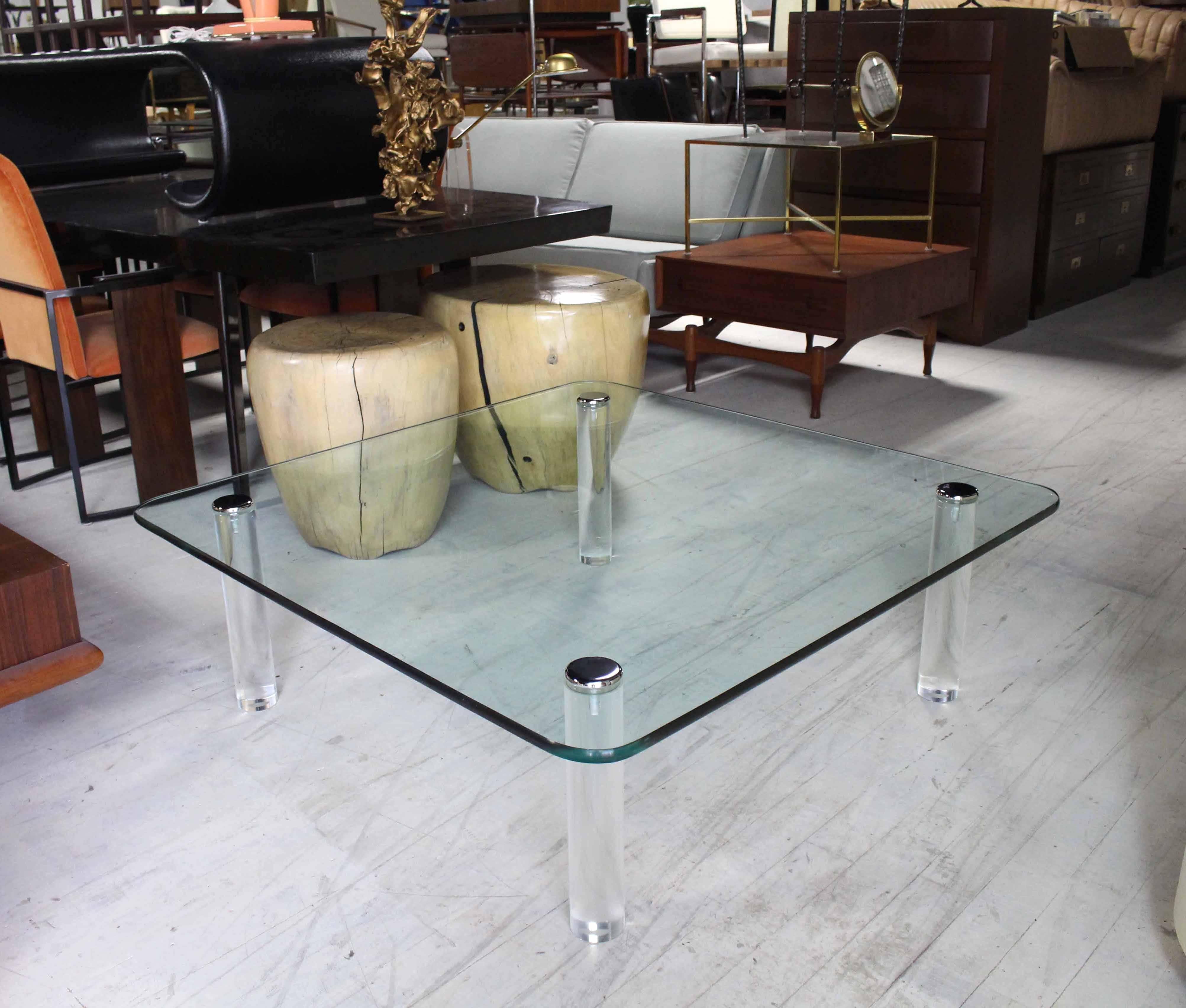 Nice thick cylinder shape Lucite legs, measures large 48" square thick 3/4" glass top coffee table.