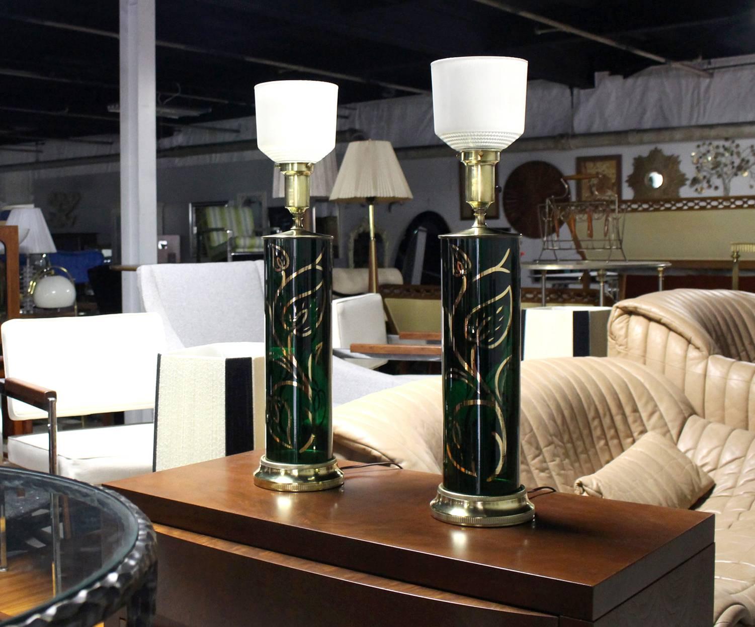 Pair of very nice emerald green glass table lamps on brass bases.