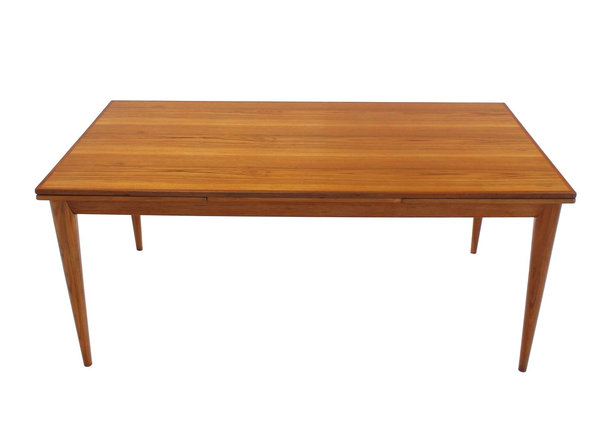 Very nicely solid built, mint condition, Danish Mid-Century Modern teak refectory table with 2 x 23