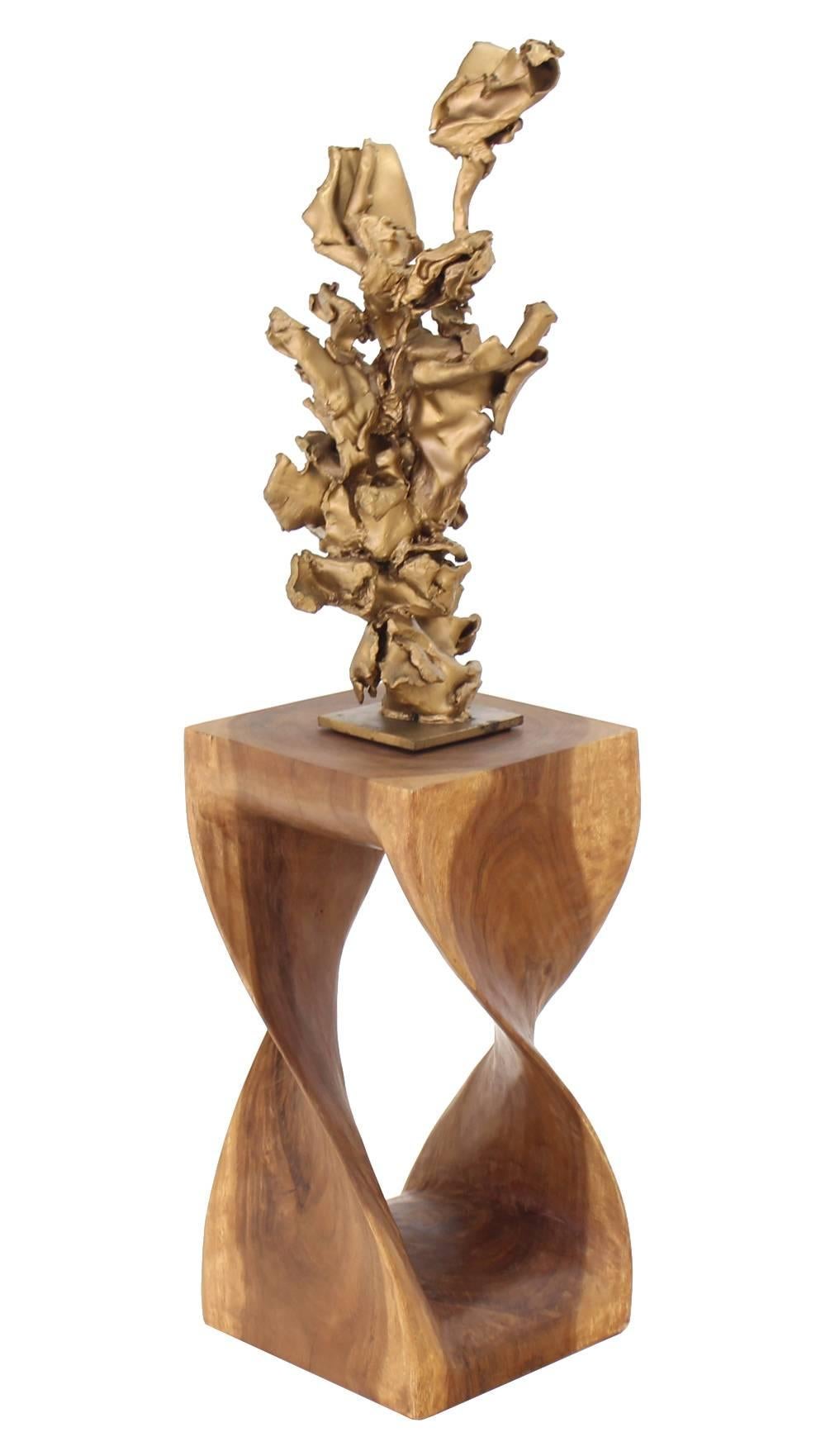 Solid wood organic shape carved pedestal.