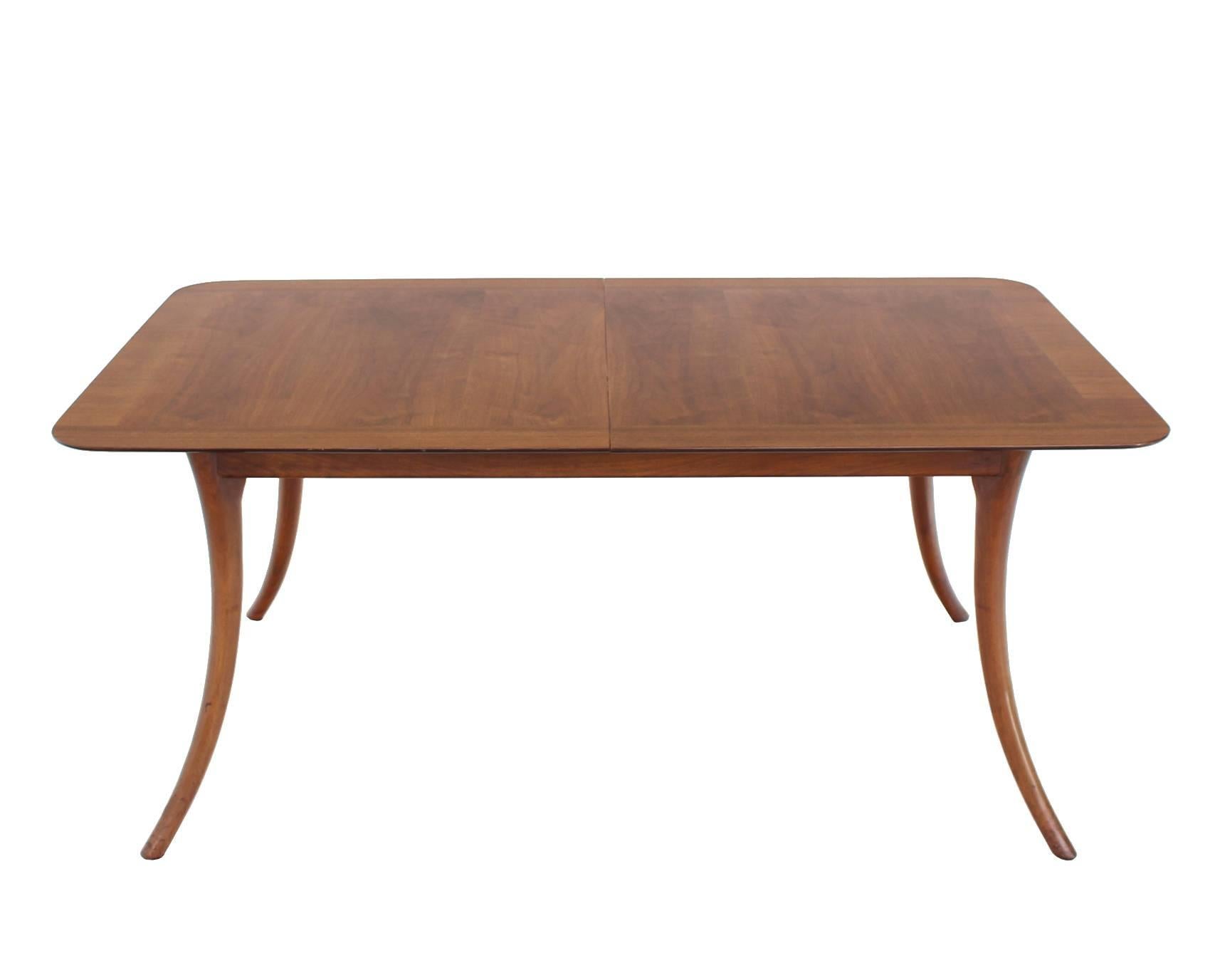 Very nice Mid-Century Modern walnut dining table designed by Robsjohn Gibbings for Widdicomb. The table is all in beautiful condition but does not come with the leaves.