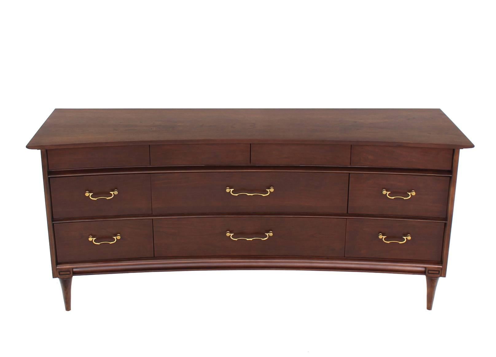 Very nice Mid-Century Modern concave top dresser with brass pulls.
