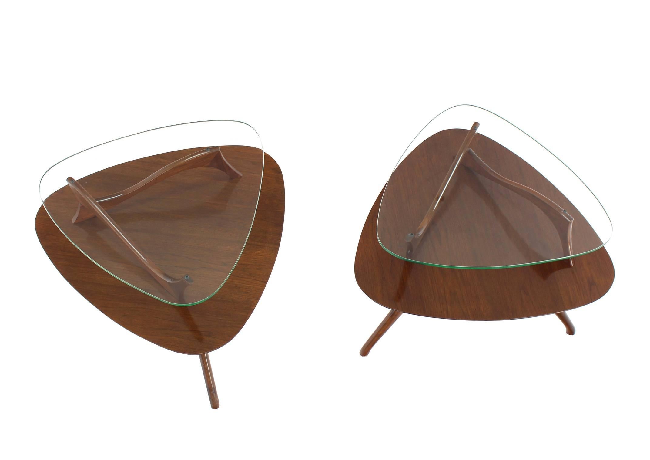 Pair of very nice glass top walnut side or end tables on beautiful sculptured legs.