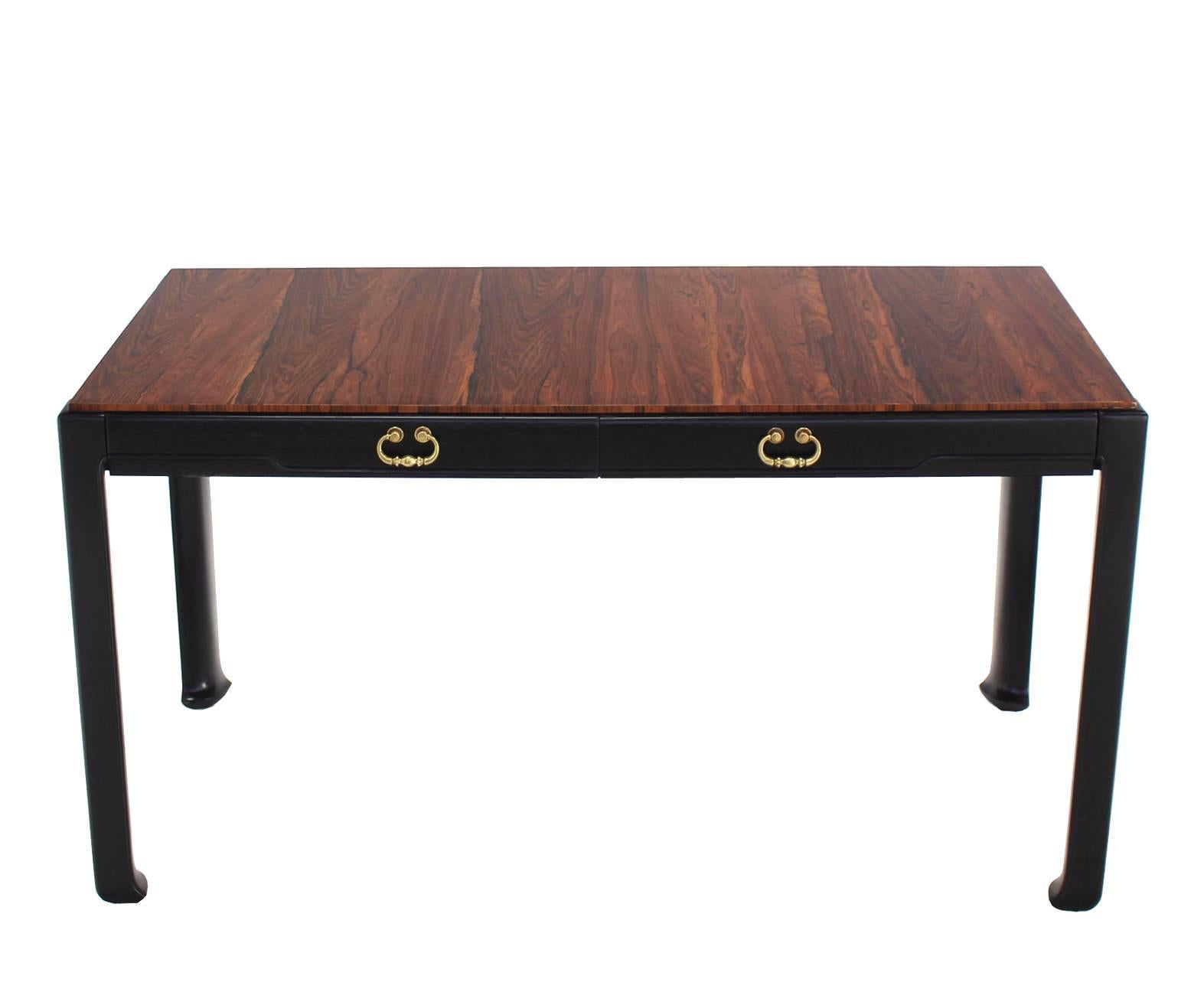 Very nice small profile Mid-Century Modern desk or console table. Two drawers design with ebonized base and brass drawer pulls.