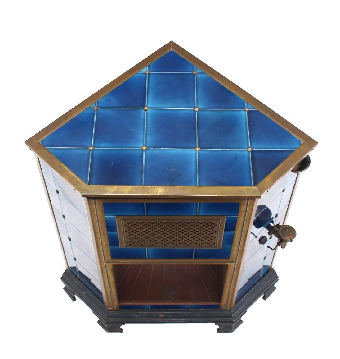 Cobalt blue tile brass trim Austrian corner gas fireplace or heater or hearth.