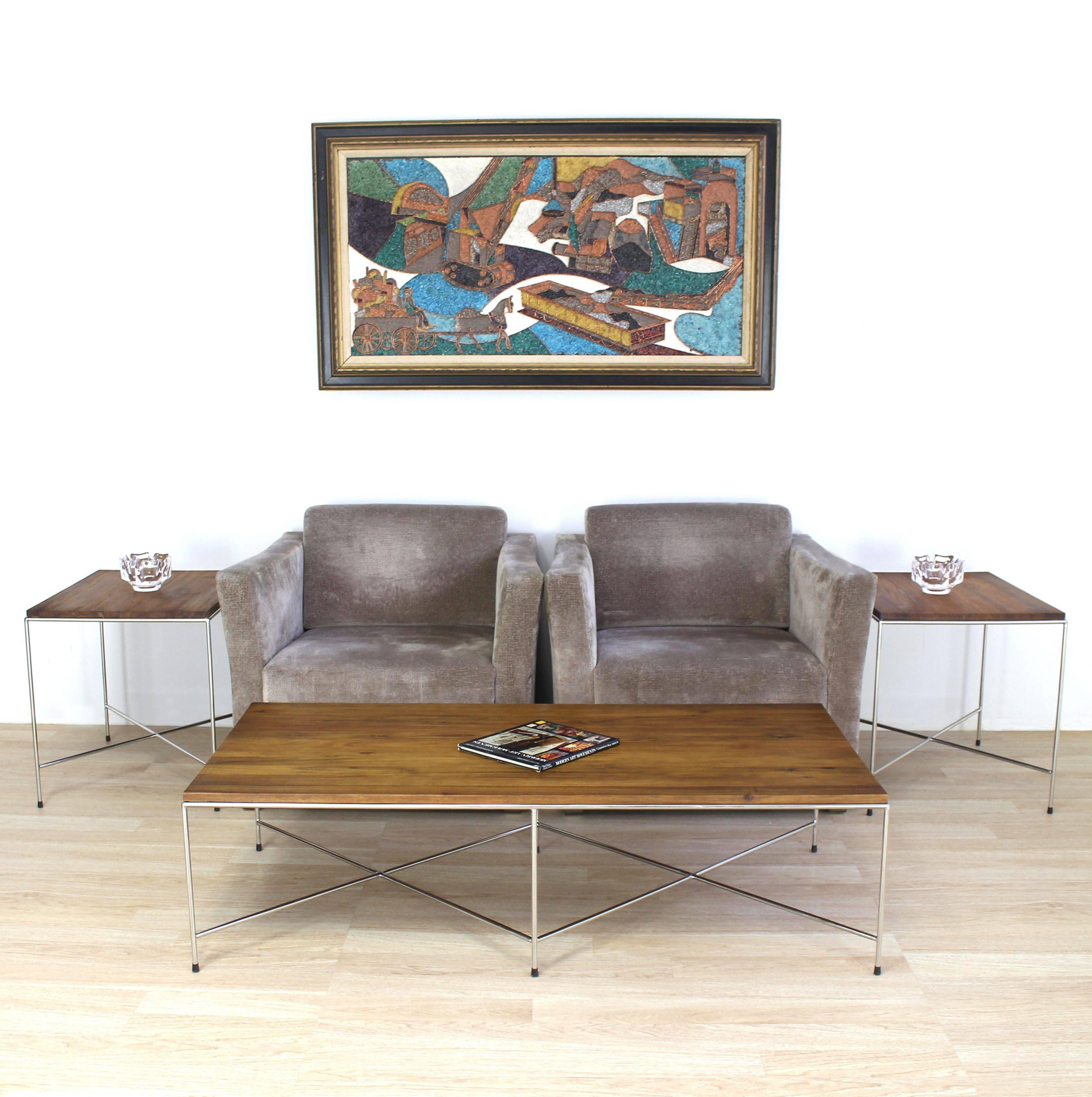 Established Lines, mid century modern decor, solid stainless steel double X-steel base cocktail table. Nice solid oiled walnut finish acacia top. The table features beautiful proportions, light design and excellent craftsmanship. Solid stainless