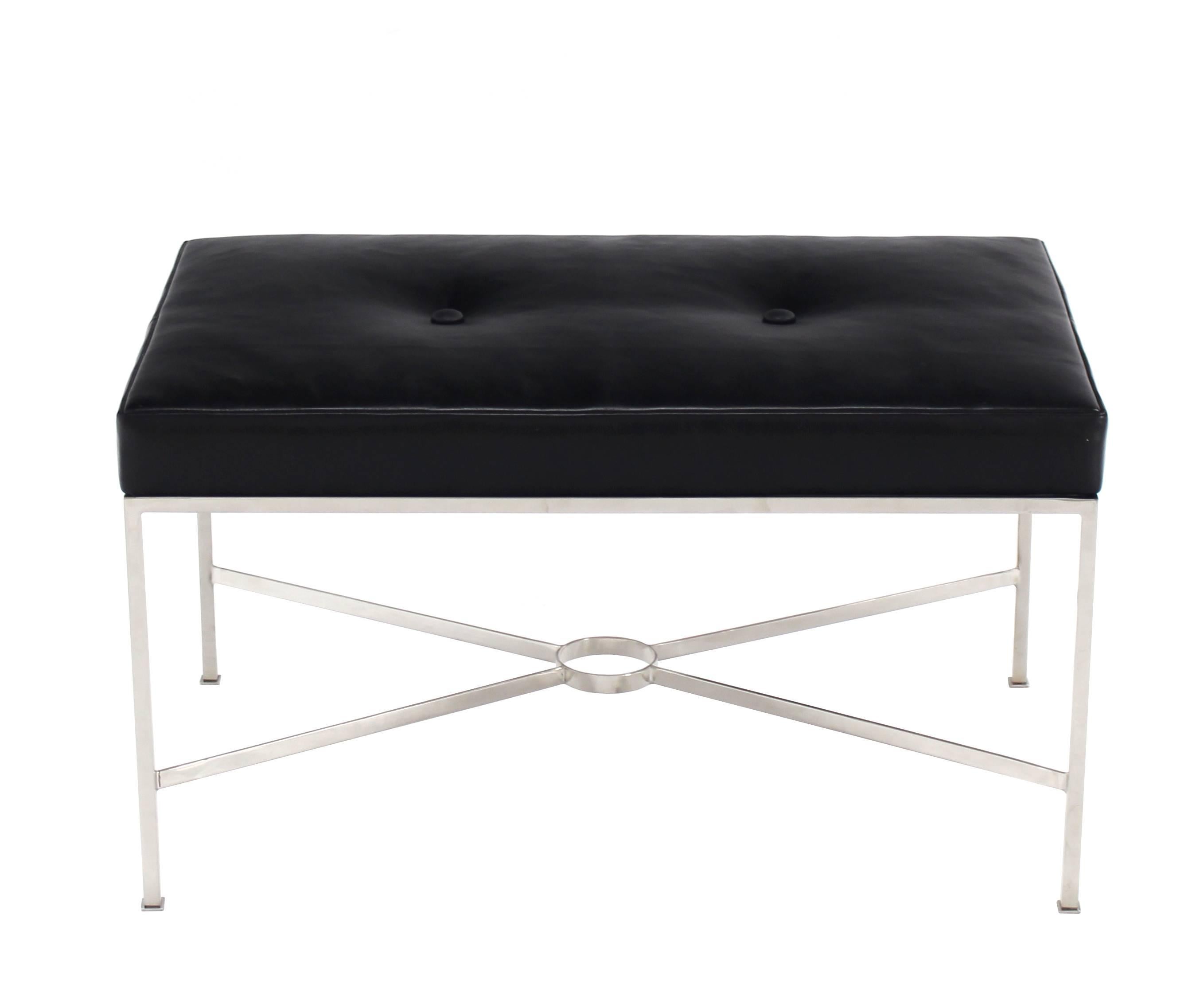 Established Lines,  mid century modern decor, solid stainless steel base rectangular X base bench in black leather upholstery.