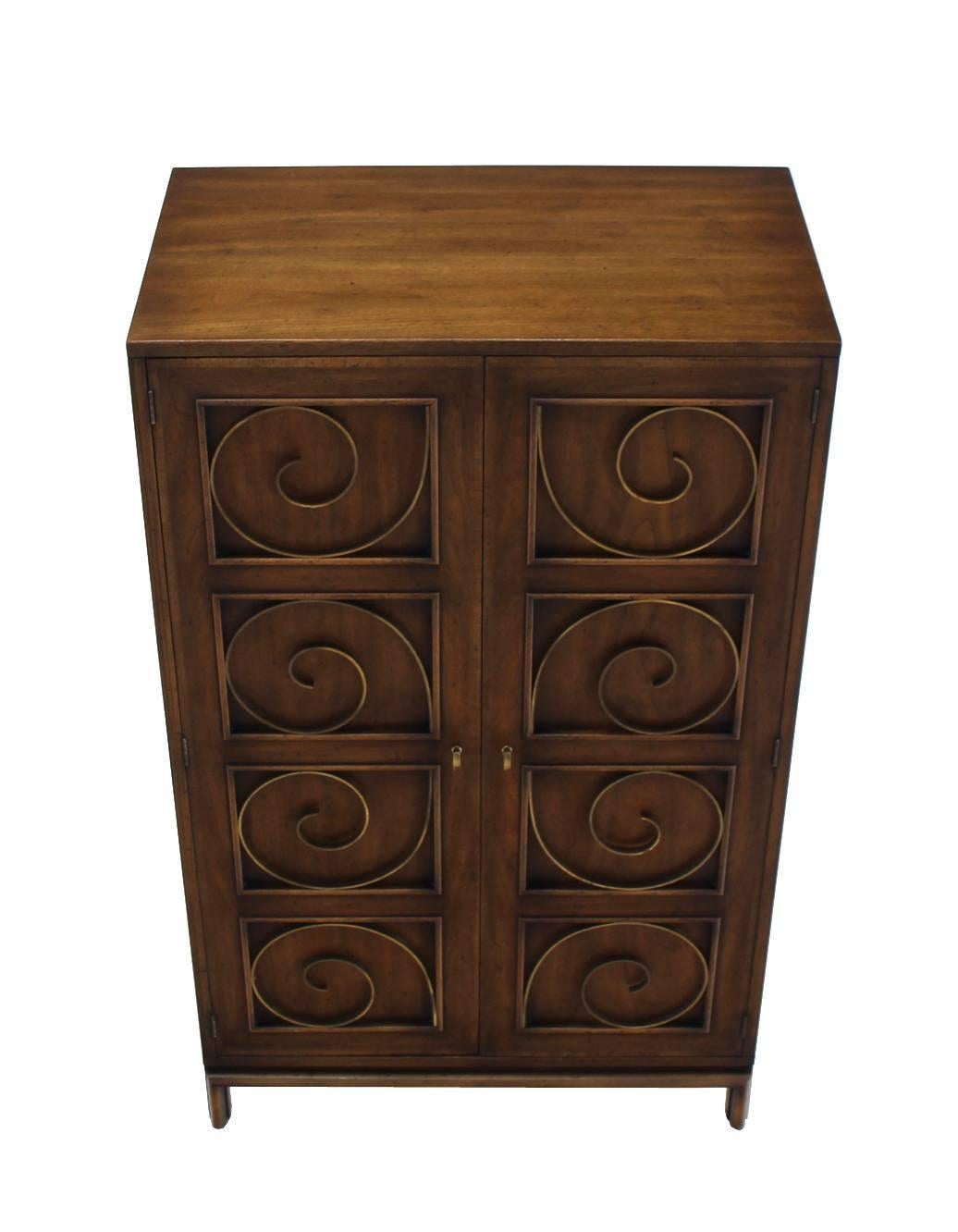 Very decorative high quality walnut finish blanket chest or cabinet with three drawers in style of Edmond Spence. The front doors are neatly decorated with solid brass scrolls.