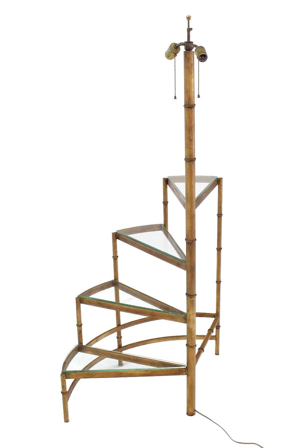 Very nice unusual spiral step shelves, gilt faux bamboo base, floor lamp.








In style of Maison Bagues
