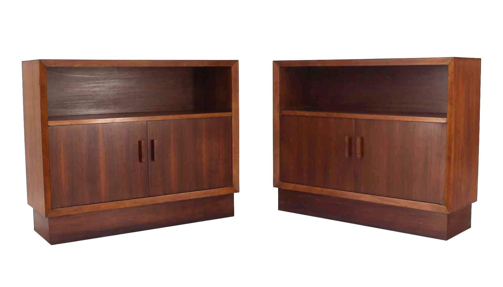 Pair of very nice Mid-Century Modern two doors credenzas or hall cabinets with storage compartment and a shelf or a small bookcase.