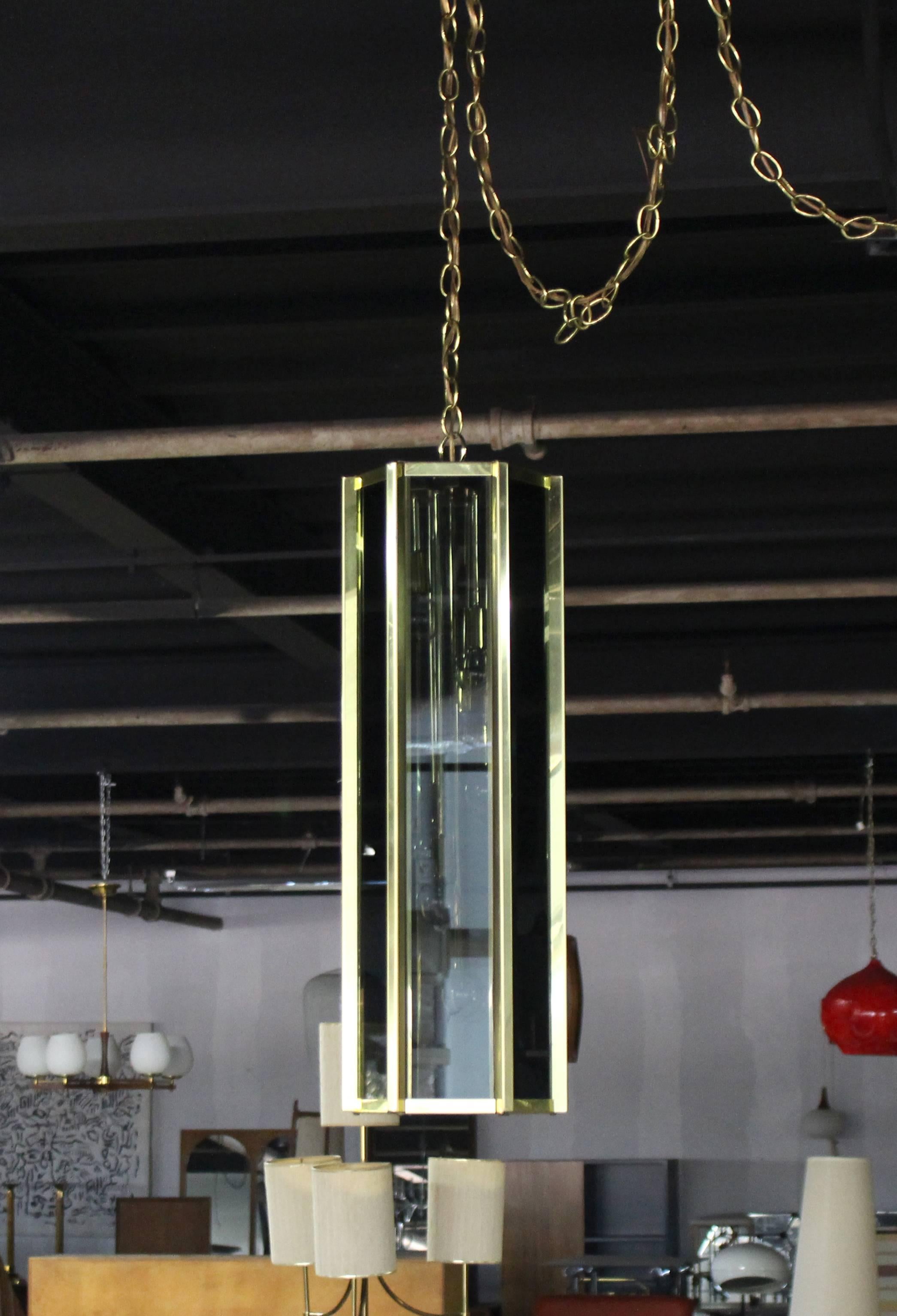 20th Century Tall and Narrow Smoked Glass and Brass Pendant Light Fixture For Sale