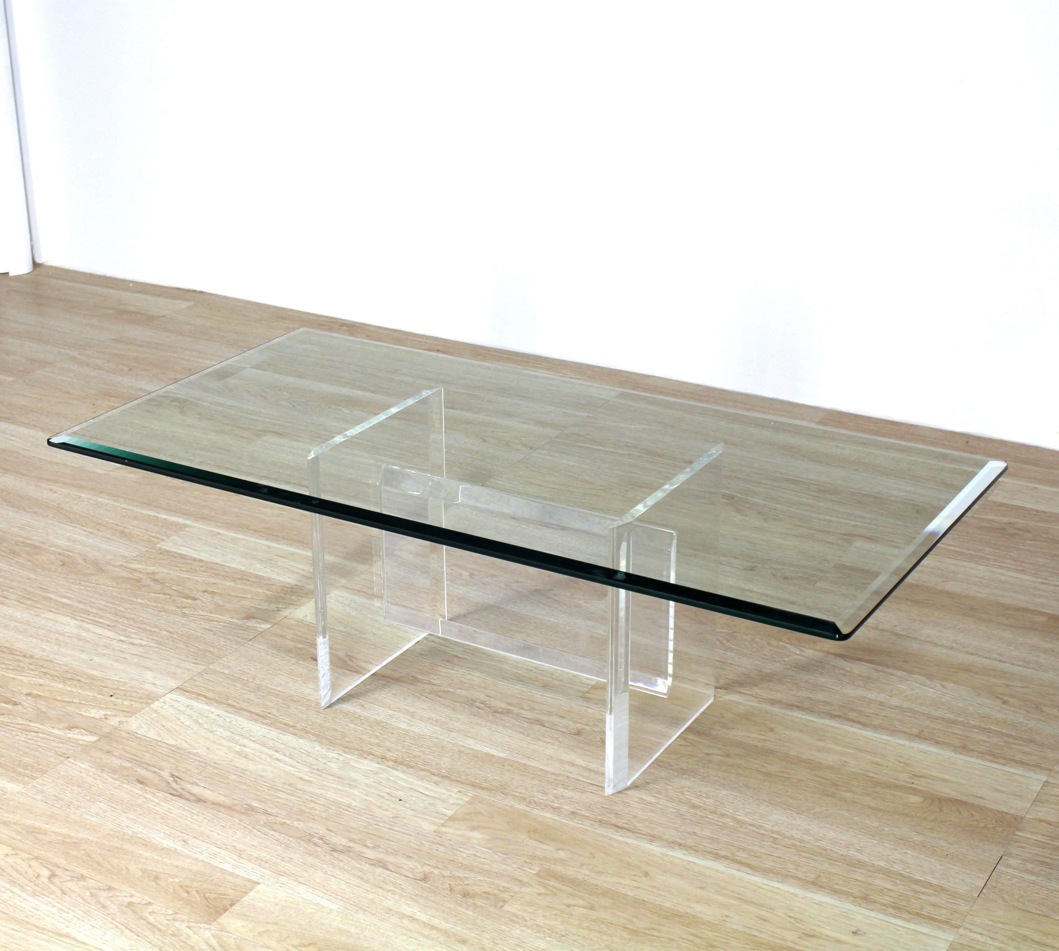 Nice shape 24 x 48 rectangle coffee table on solid Lucite base.