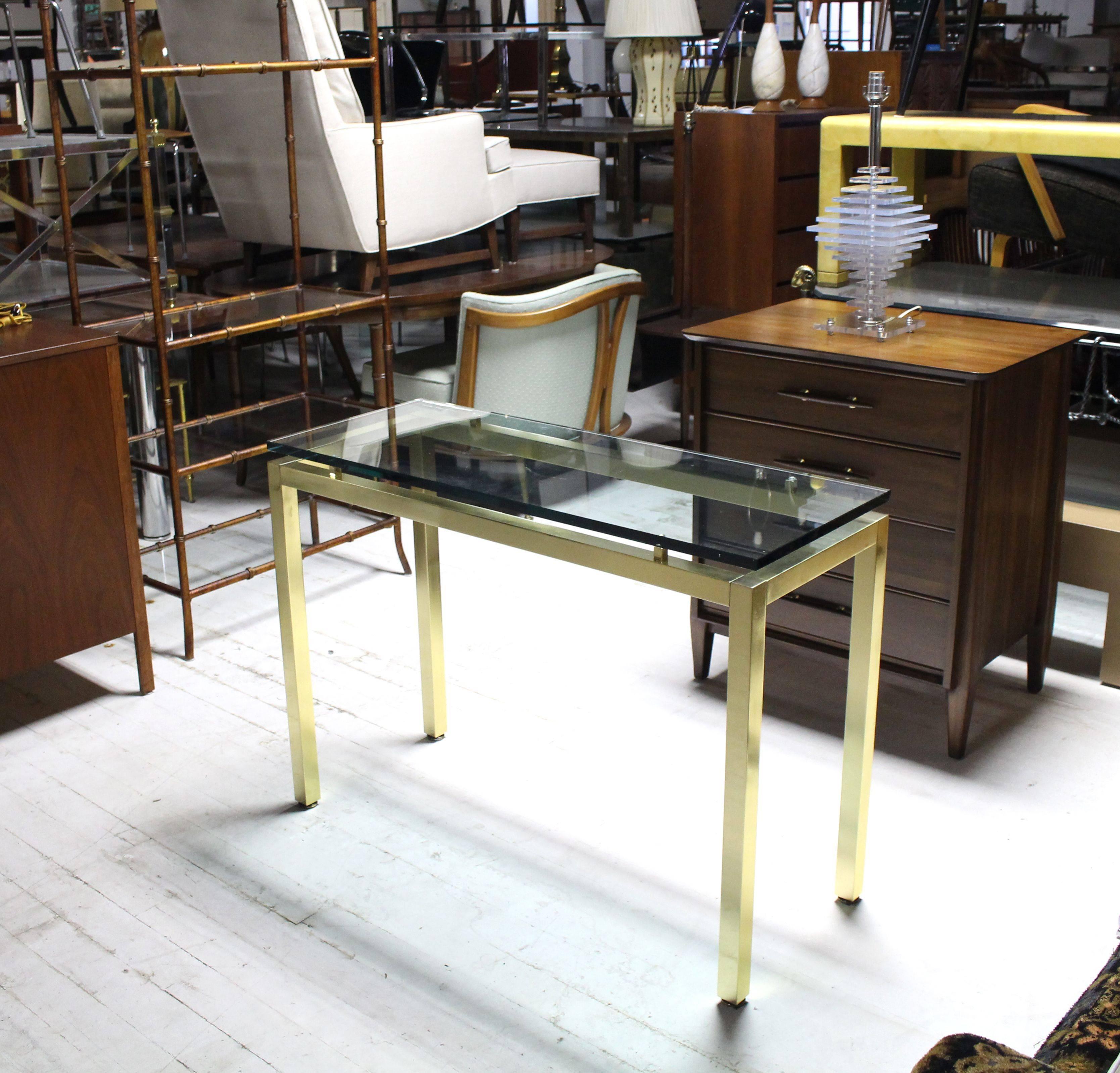 Very nice Mid-Century Modern brass base floating thick glass top console table.