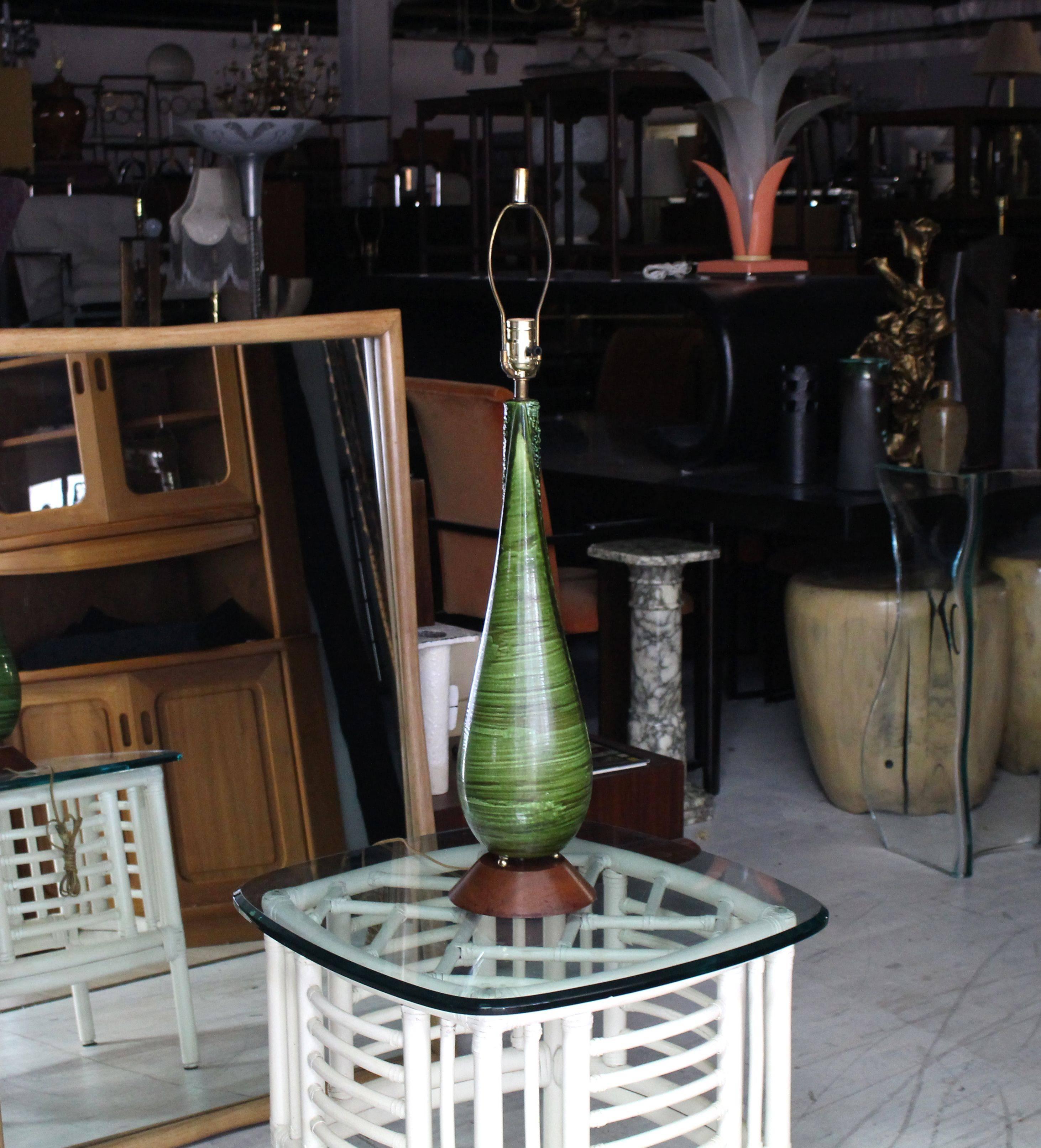 Very nice Mid-Century Modern art pottery green glaze over ceramic base table lamp on walnut base.