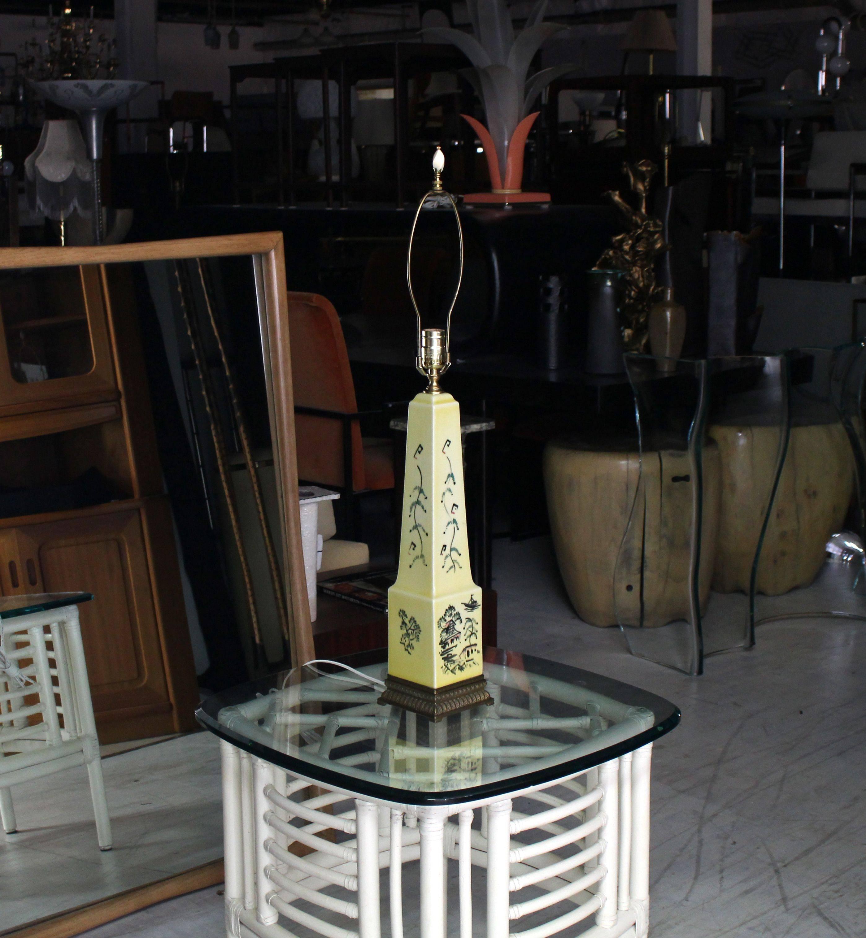 Very nice Mid-Century Modern obelisk shape ceramic decorated table lamp on brass base.