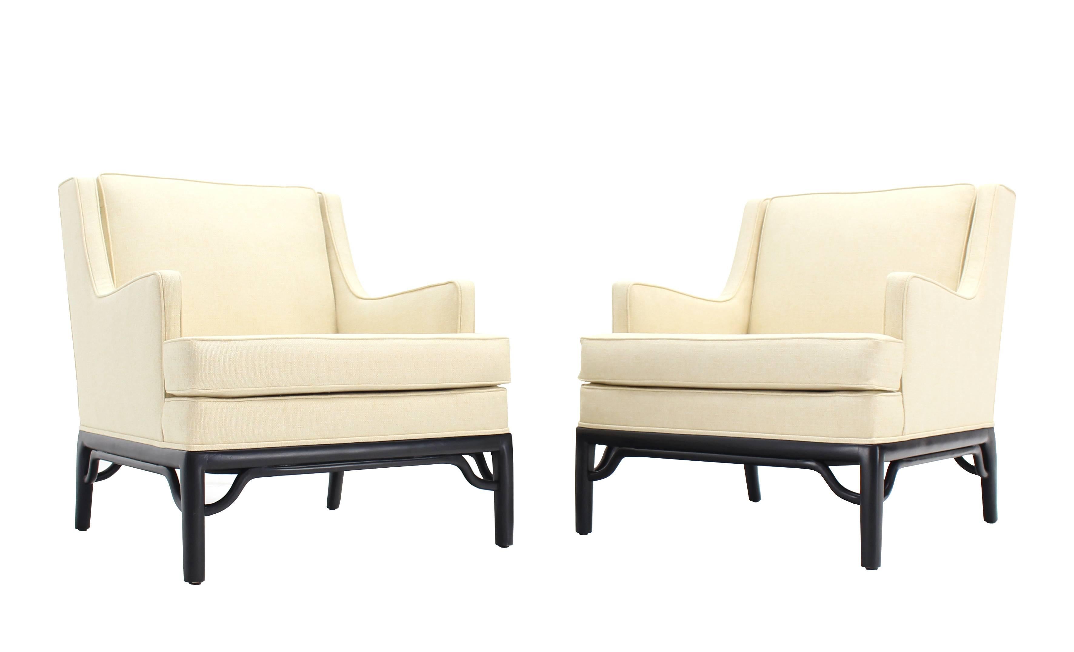 Very nice pair of newly upholstered, Mid-Century Modern lounge chairs.