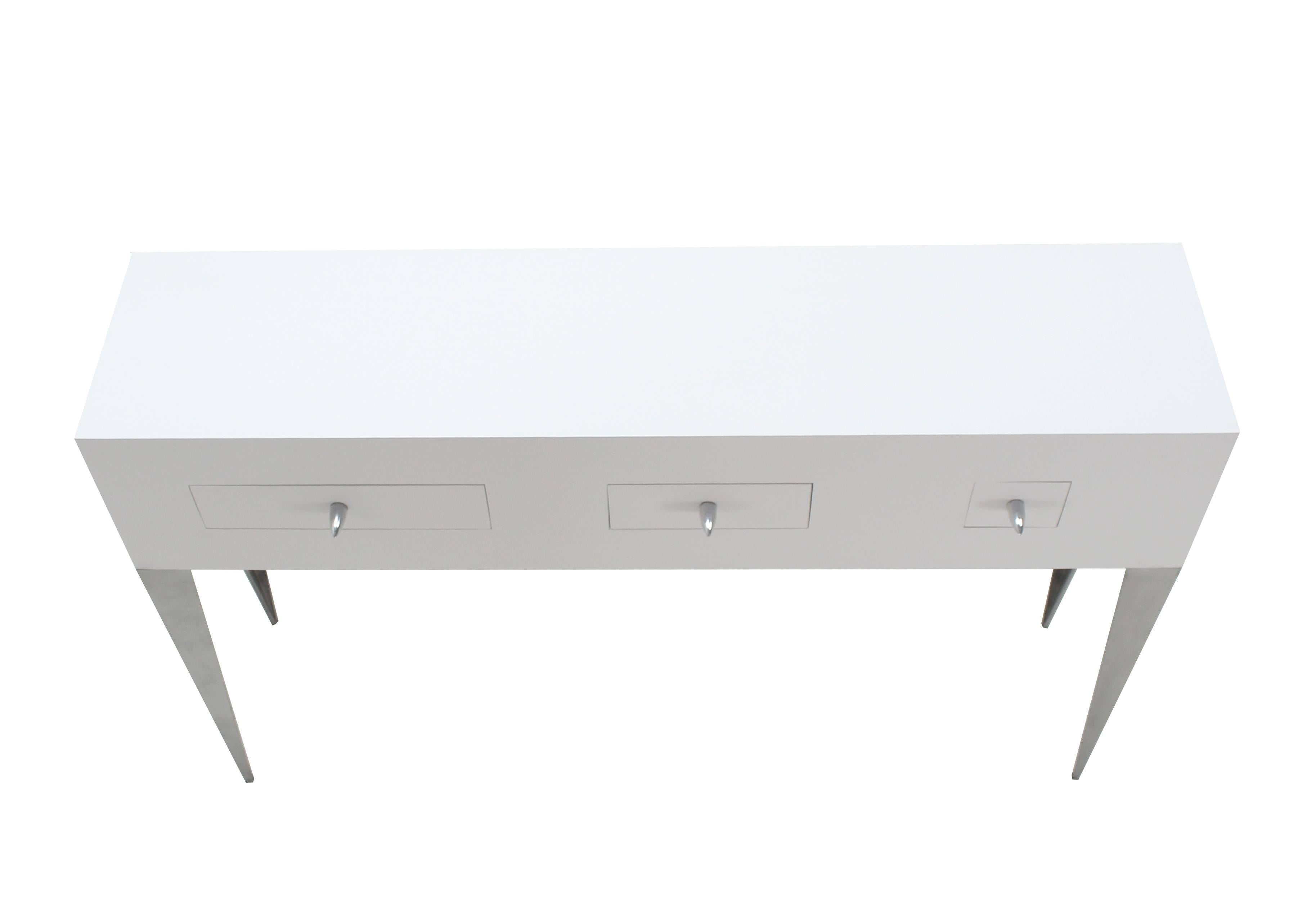 Nice modern white lacquer console or small credenza on metal legs.