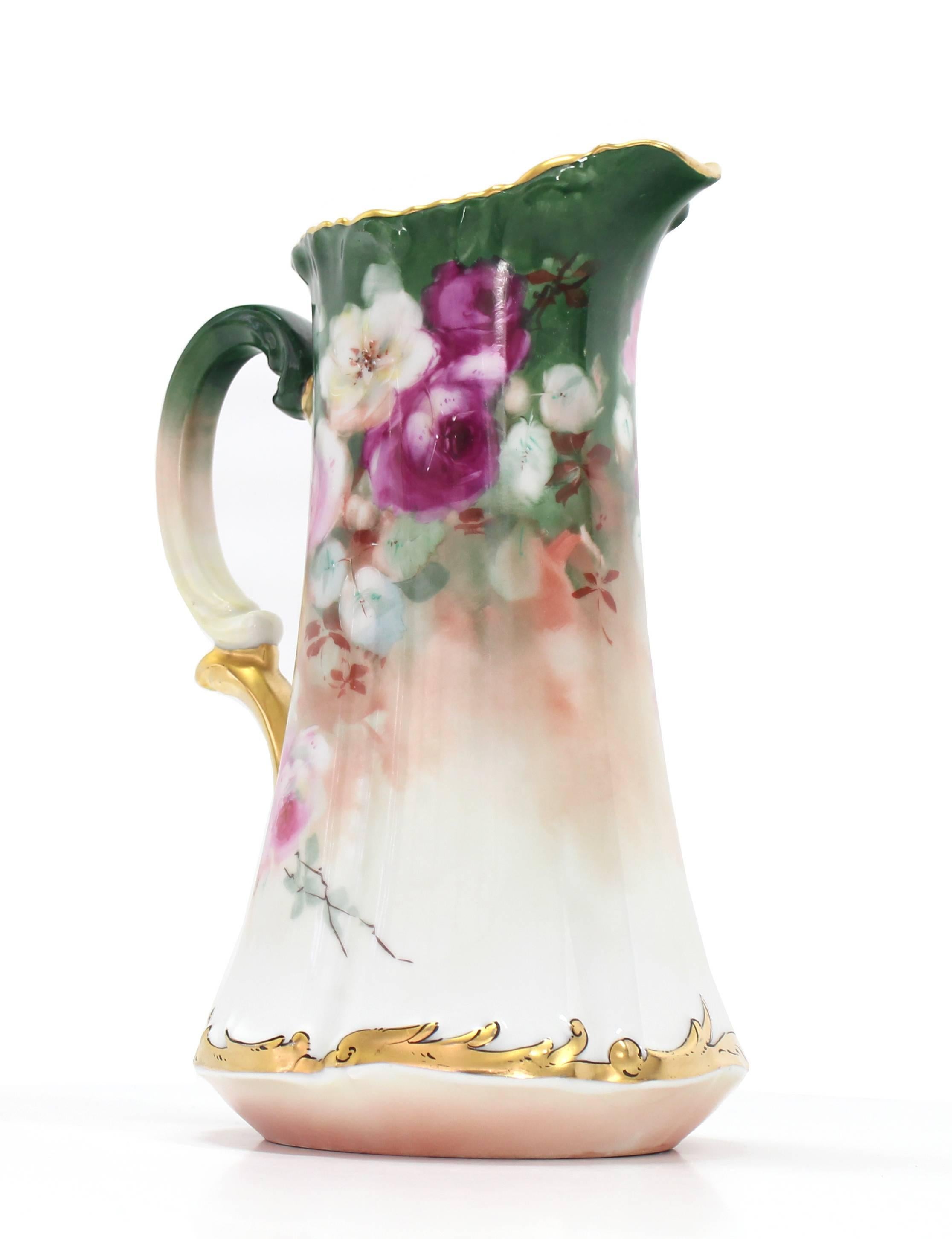 Very nice floral French porcelain pitcher.