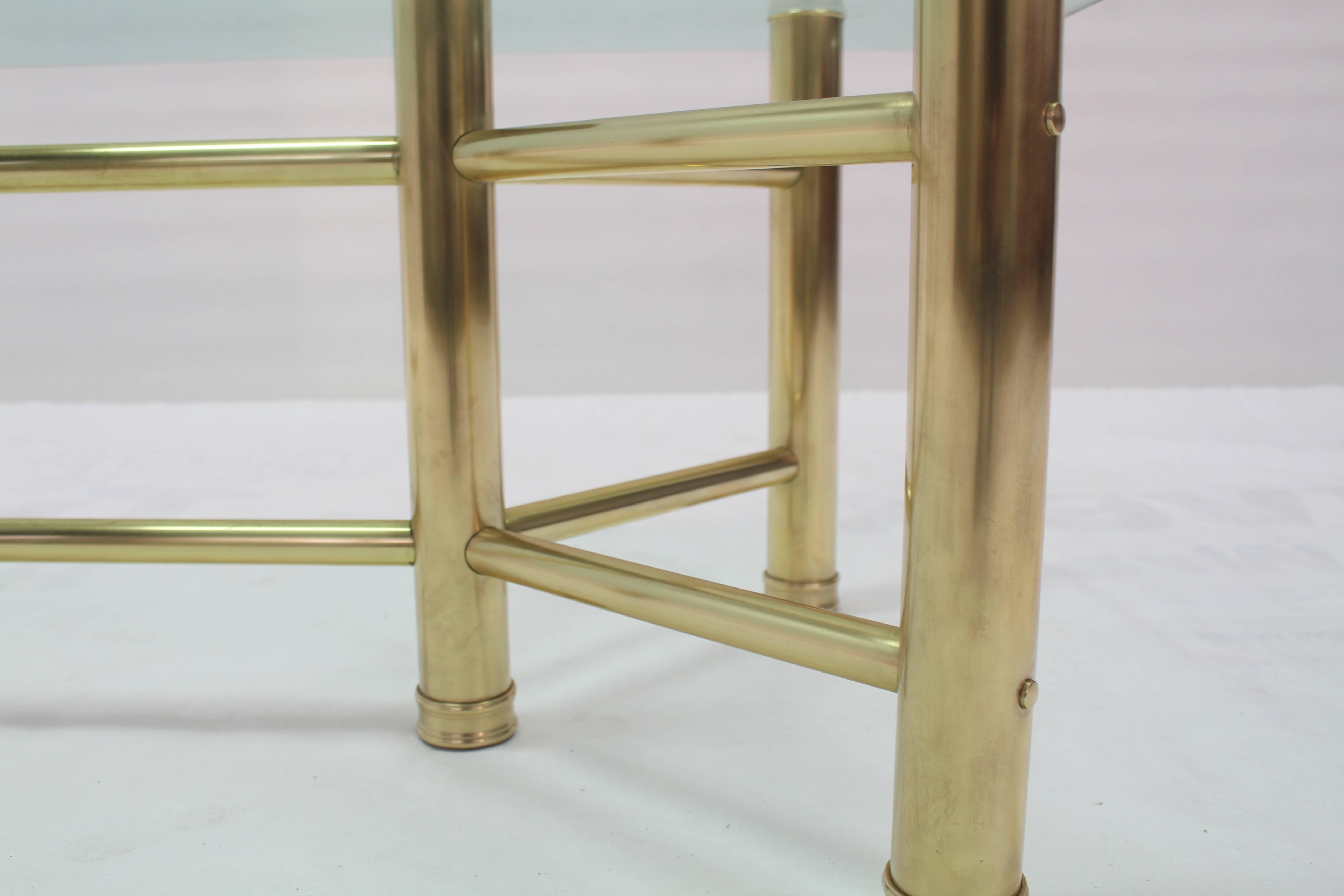 Mid-Century Modern six legged solid brass tube coffee table.
