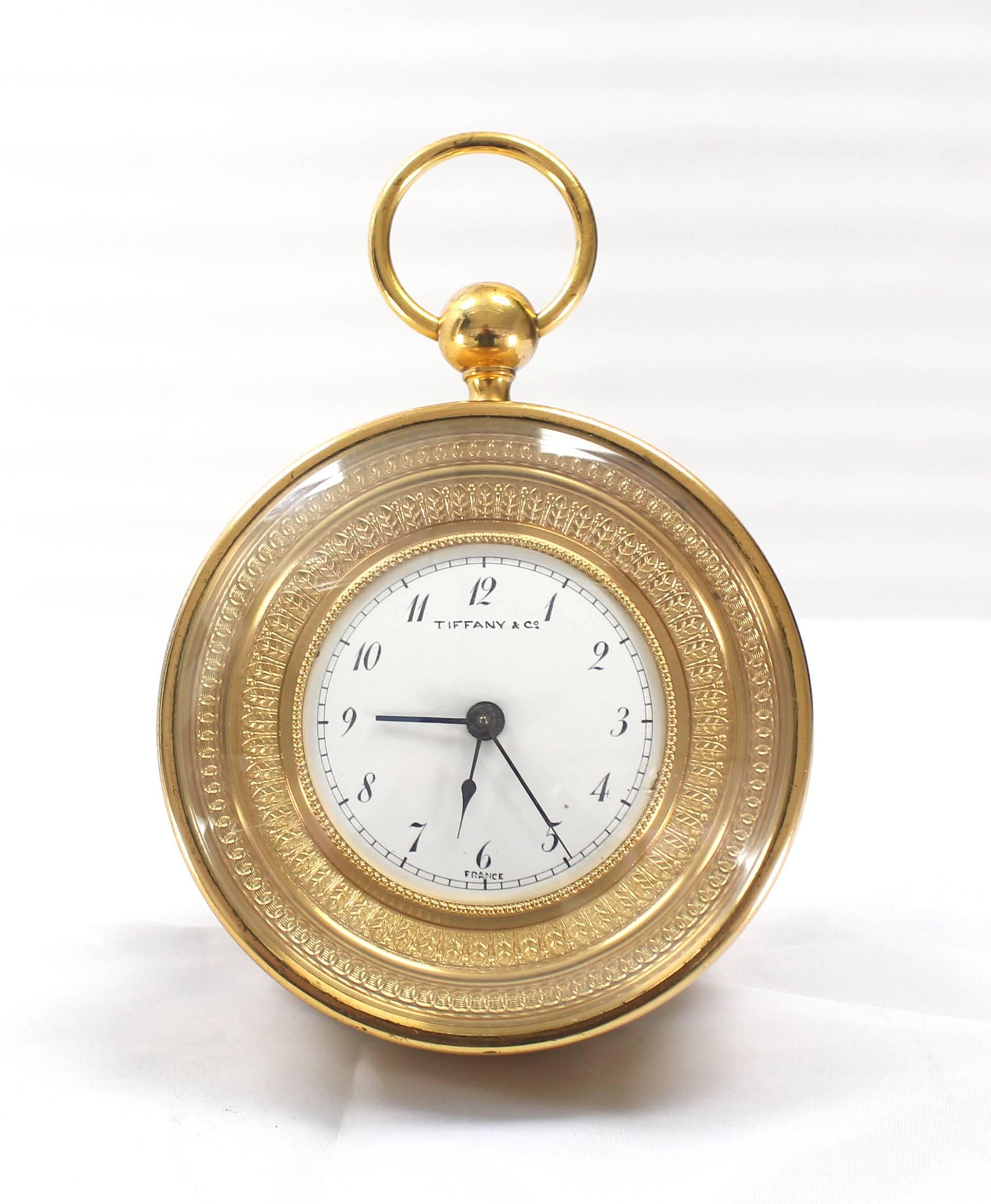 Very nice antique Tiffany bronze travel alarm clock. Clock is in good working condition. One of the original crowns missing. One crown can be shared to adjust time and alarm hands.
 