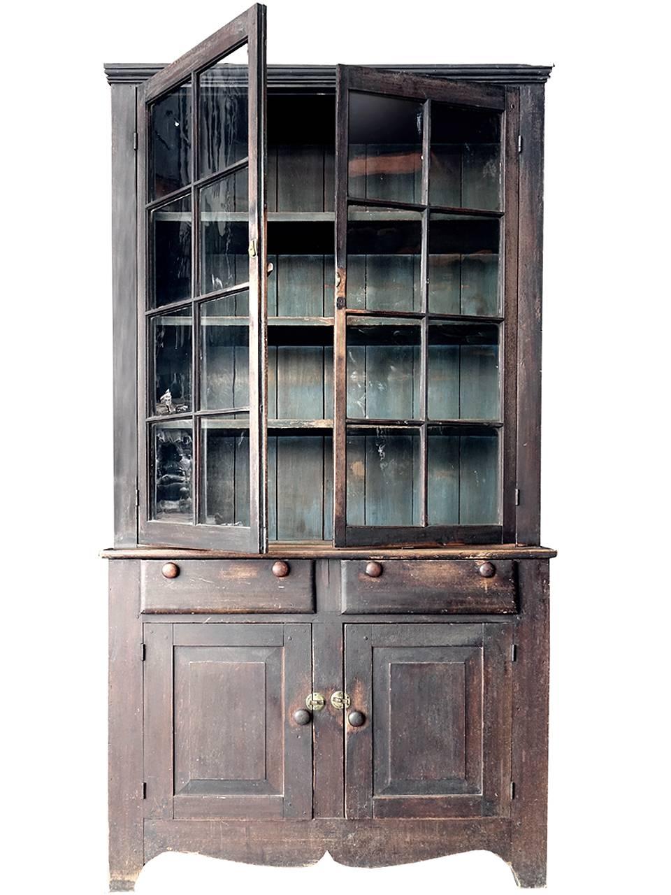 This poplar cupboard came from a farmhouse in Scioto County, Ohio. It is entirely original except for one pane of glass. The nicely warn paint and subtle colors make this example very elegant. The paint wear is in just the right places and the wavy