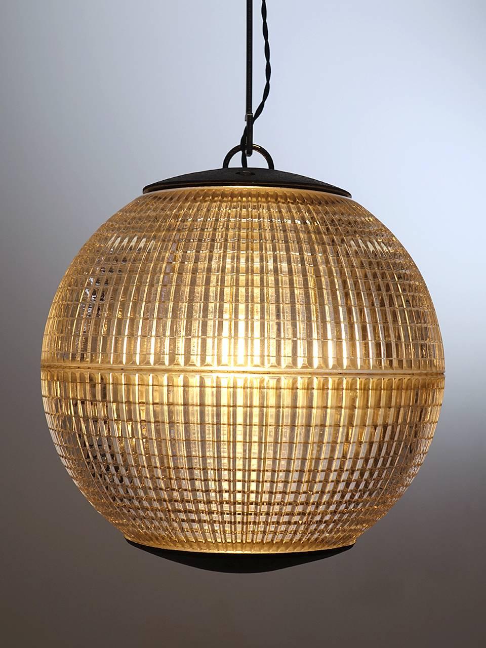 This iconic midcentury prismatic sphere once lighted the thoroughfares of Paris. If you have spent time there you know these lamps well. Since being saved from it's lamp post, this Industrial globe has been rewired for modern, indoor use and the end