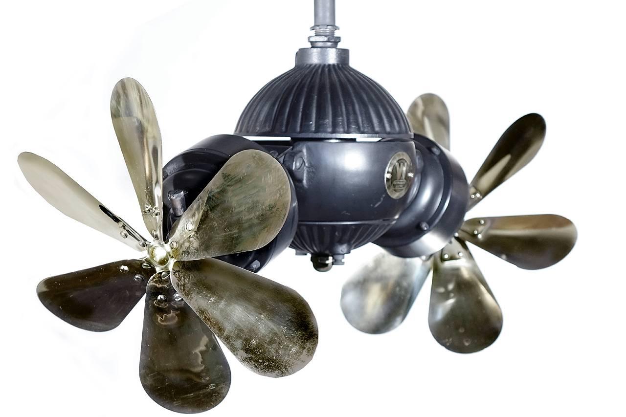 This is a very rare and early Westinghouse Gyro ceiling fan. It's one of the most sought after fans made and an iconic example of early American inventiveness. It spins as the blades are blowing air and has a belt that drives the rotating part of