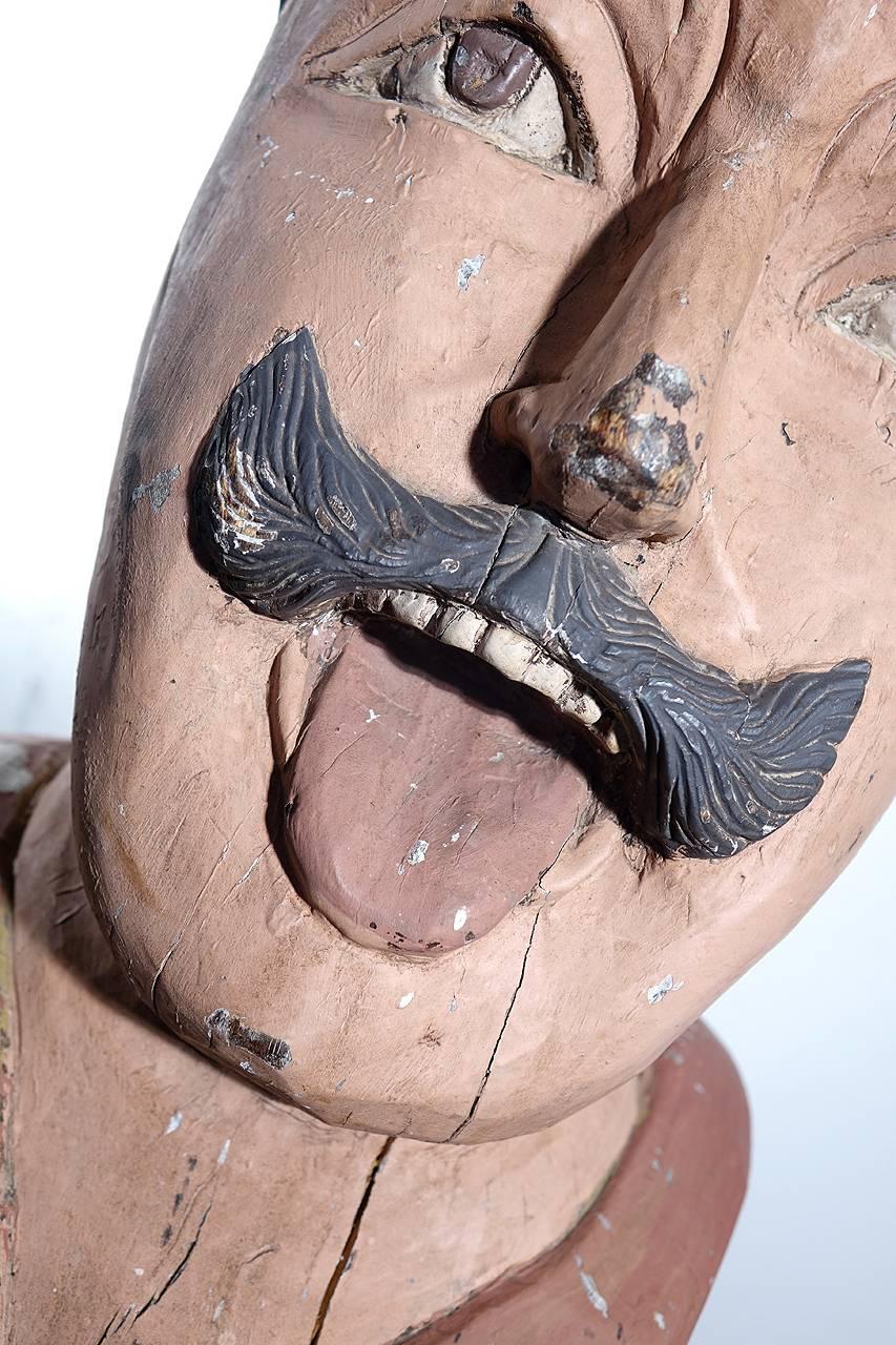 A gaper is a wooden head, often depicting a moor, on the front of a building in the Netherlands. It was used to indicate that this building is a pharmacy.

This is an early hand-carved and painted wood example. It has almost all the paint intact