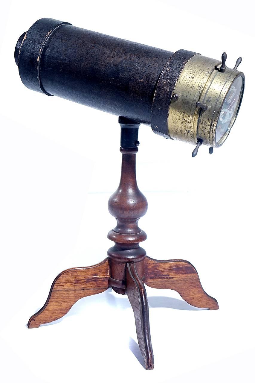 This kaleidoscope is in beautiful original condition with one tiny dent on the edge of the brass. This example is also signed and dated in 2 places... Once stamped on the brass ring and stamped in the wood. The 4 legs example is the configuration